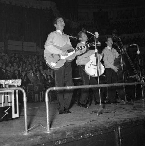 Vocal Trio Performing On Stage
