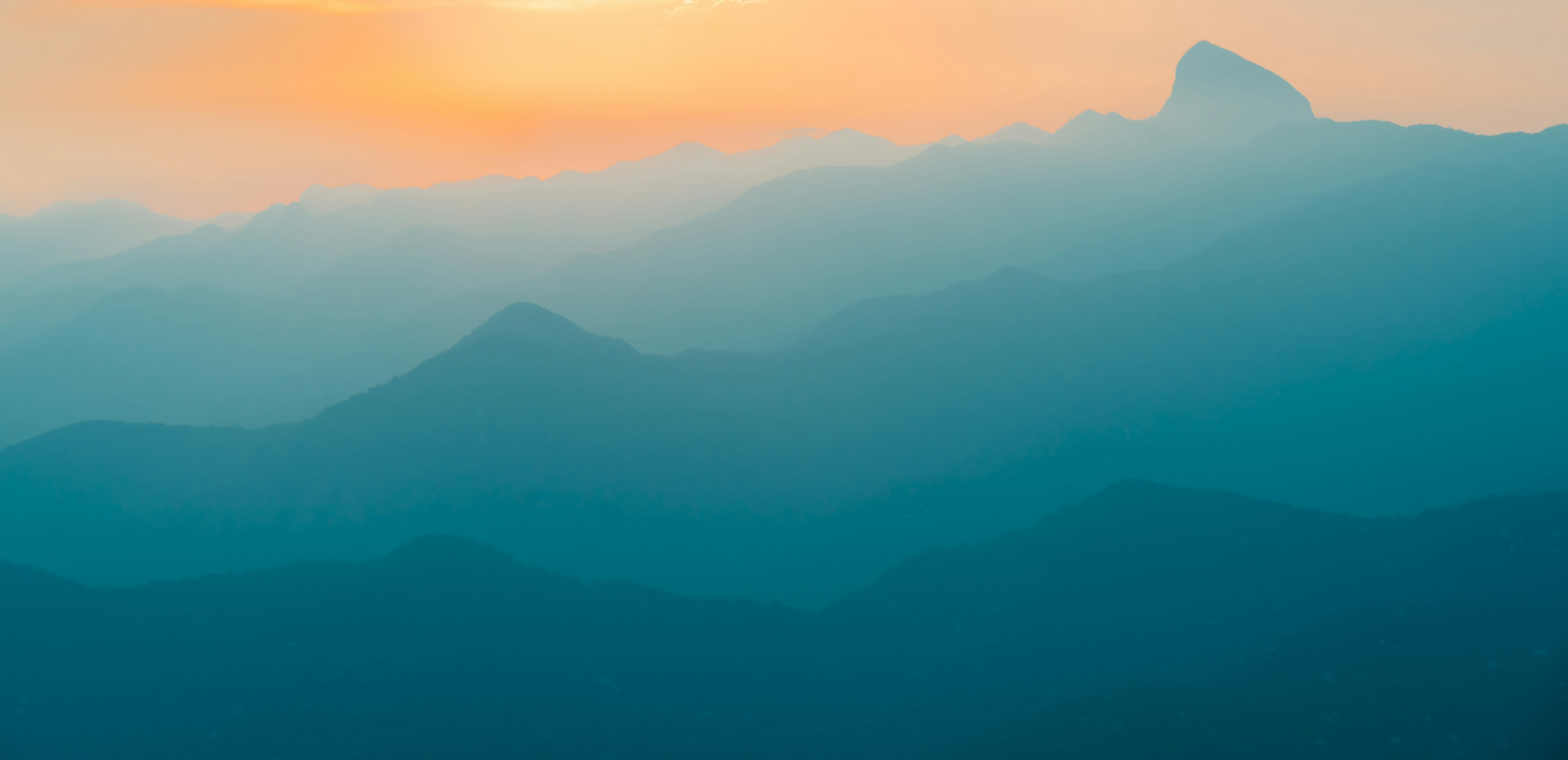 Layered Mountains at Sunset
