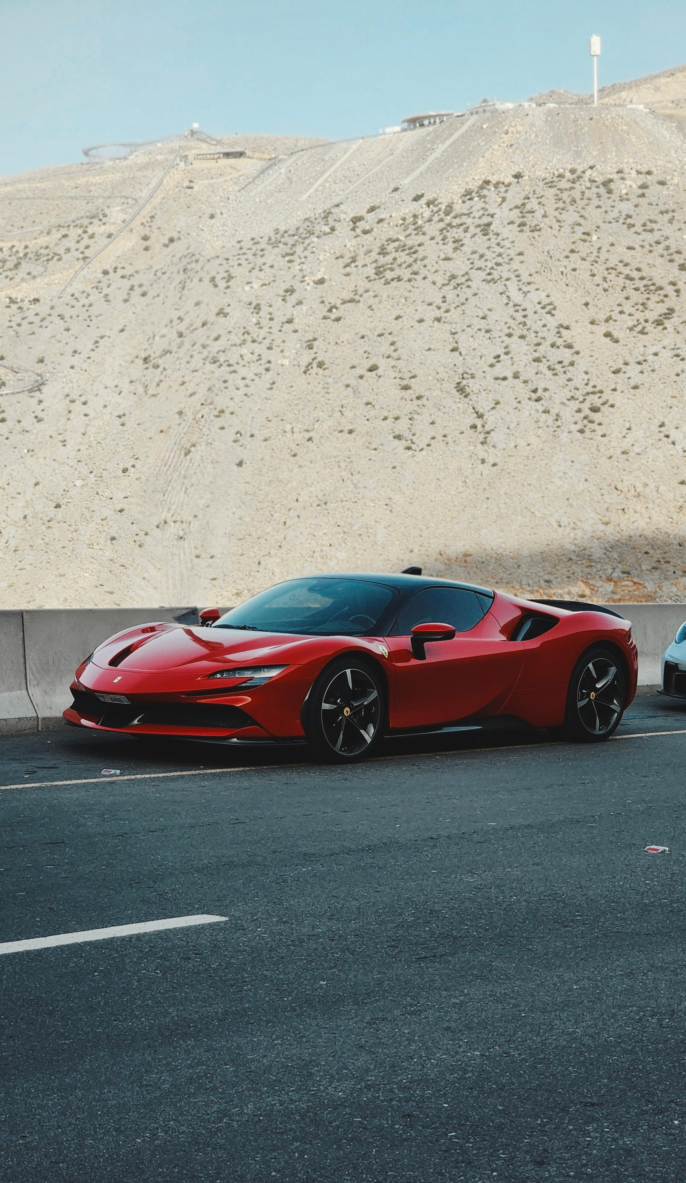 Red Ferrari on Mountain Road