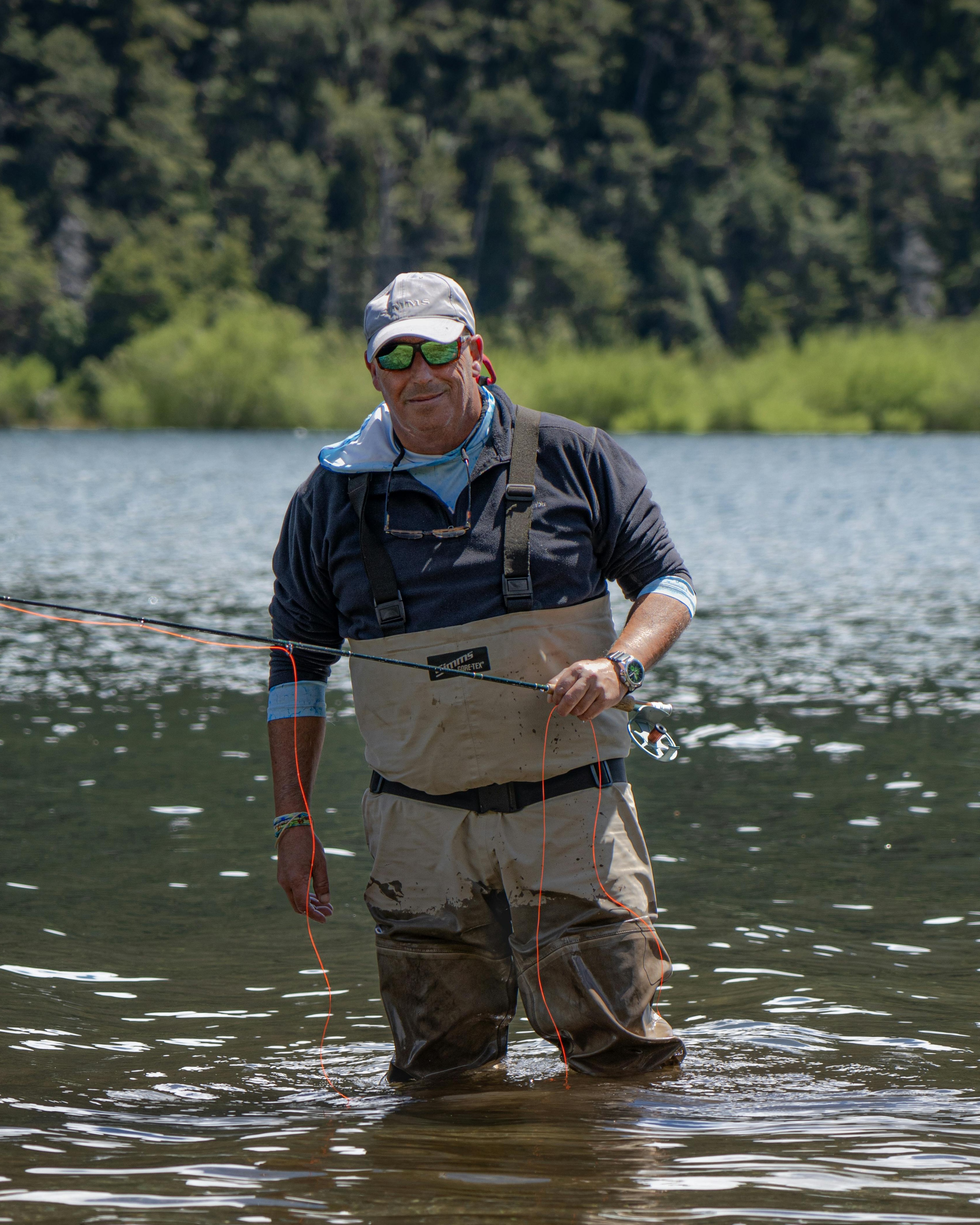 Man Fly Fishing In A River