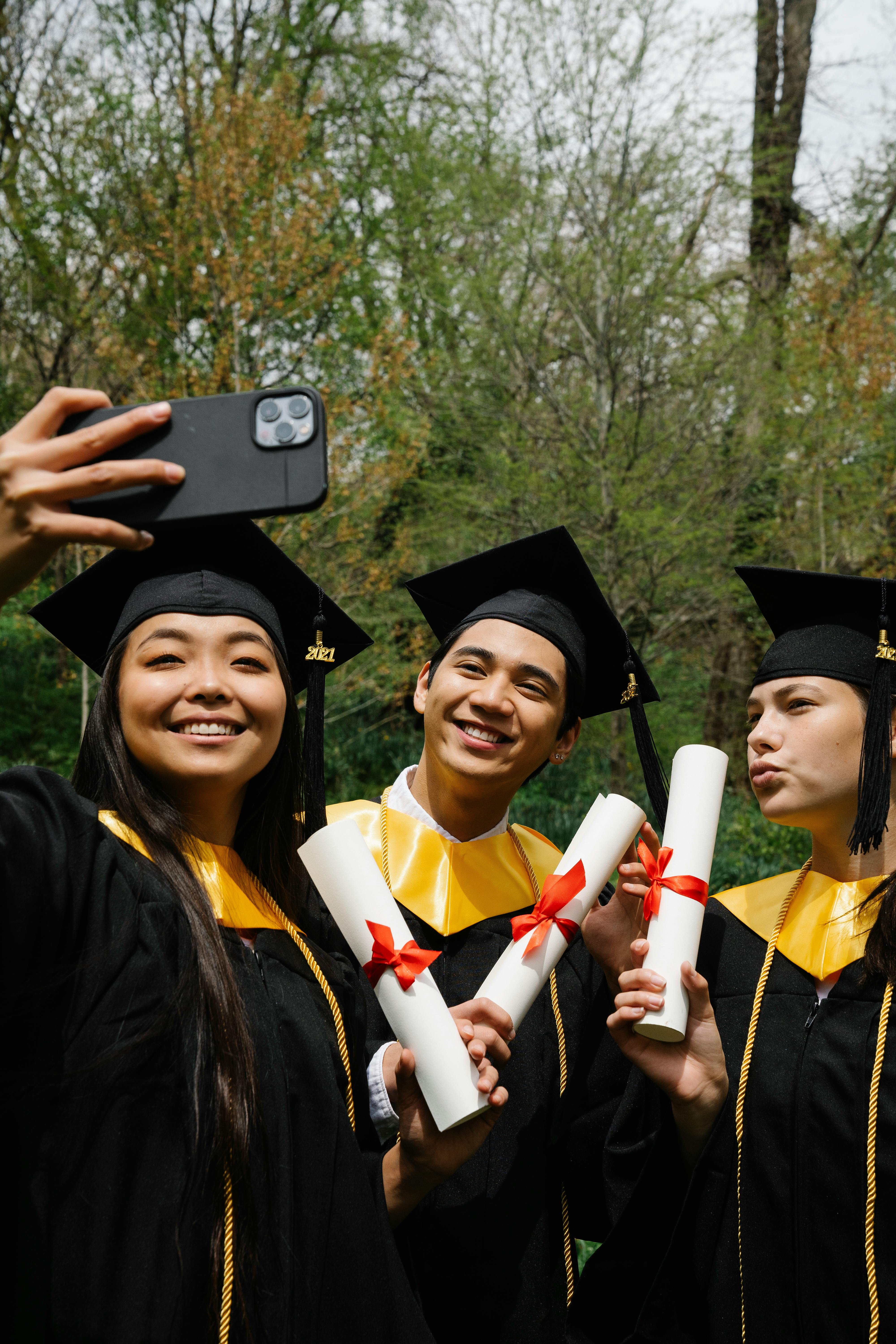Three Graduates Taking Graduation Selfie