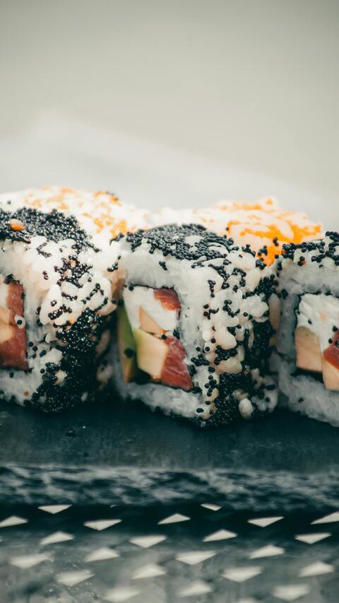 Close Up of Topped Sushi Rolls