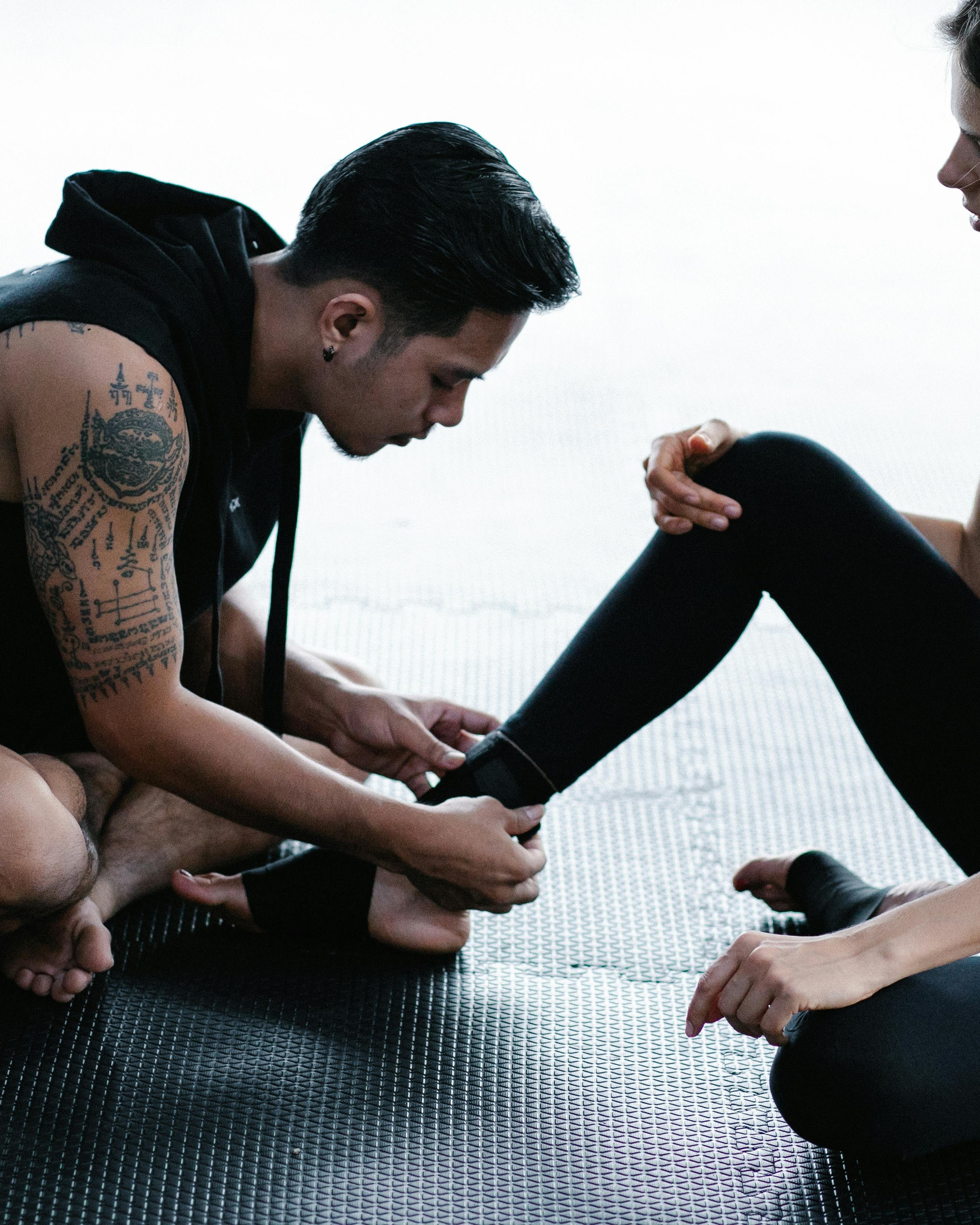Trainer Taping Athlete's Ankle