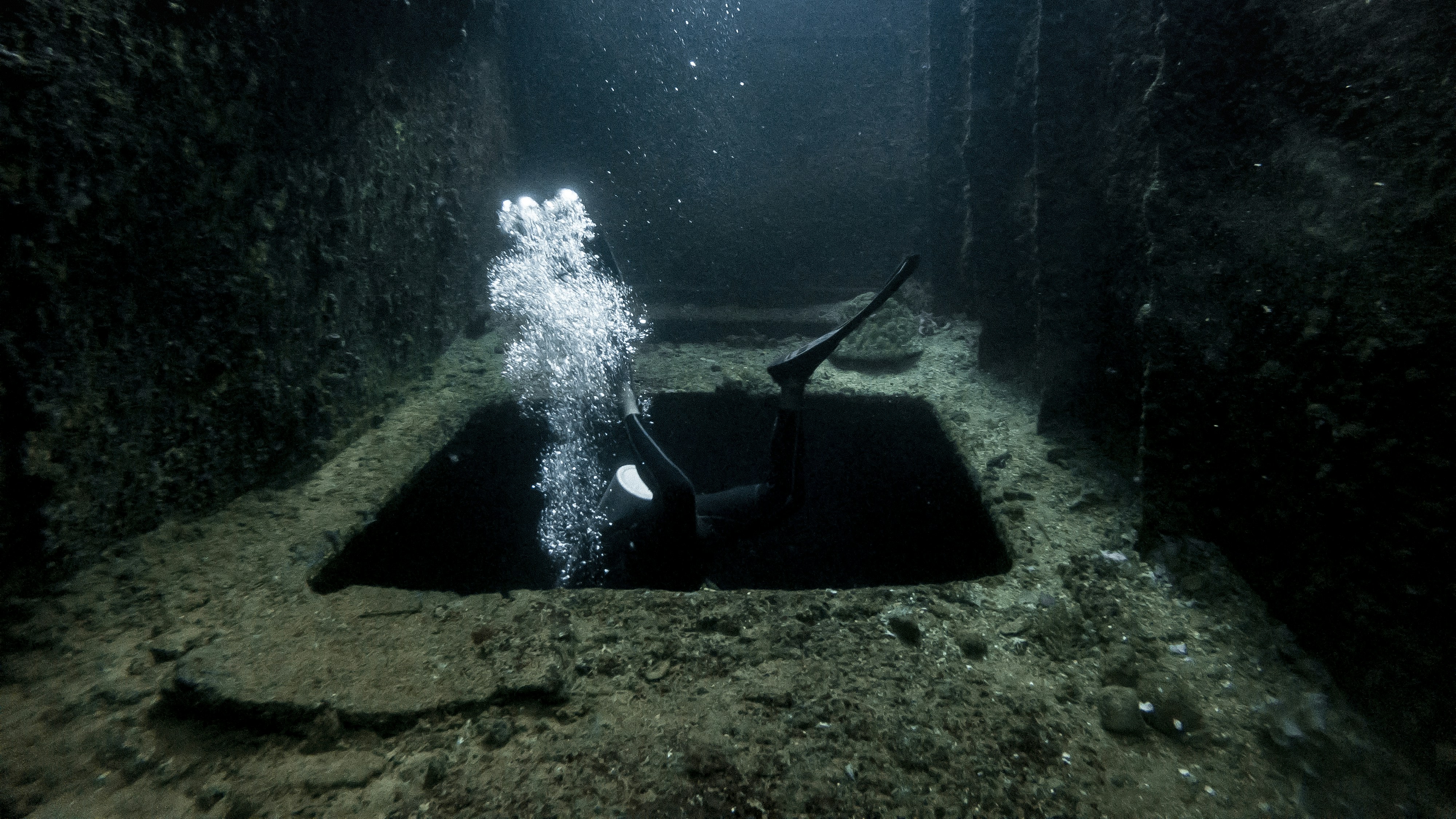 Diver Entering Underwater Wreck Opening