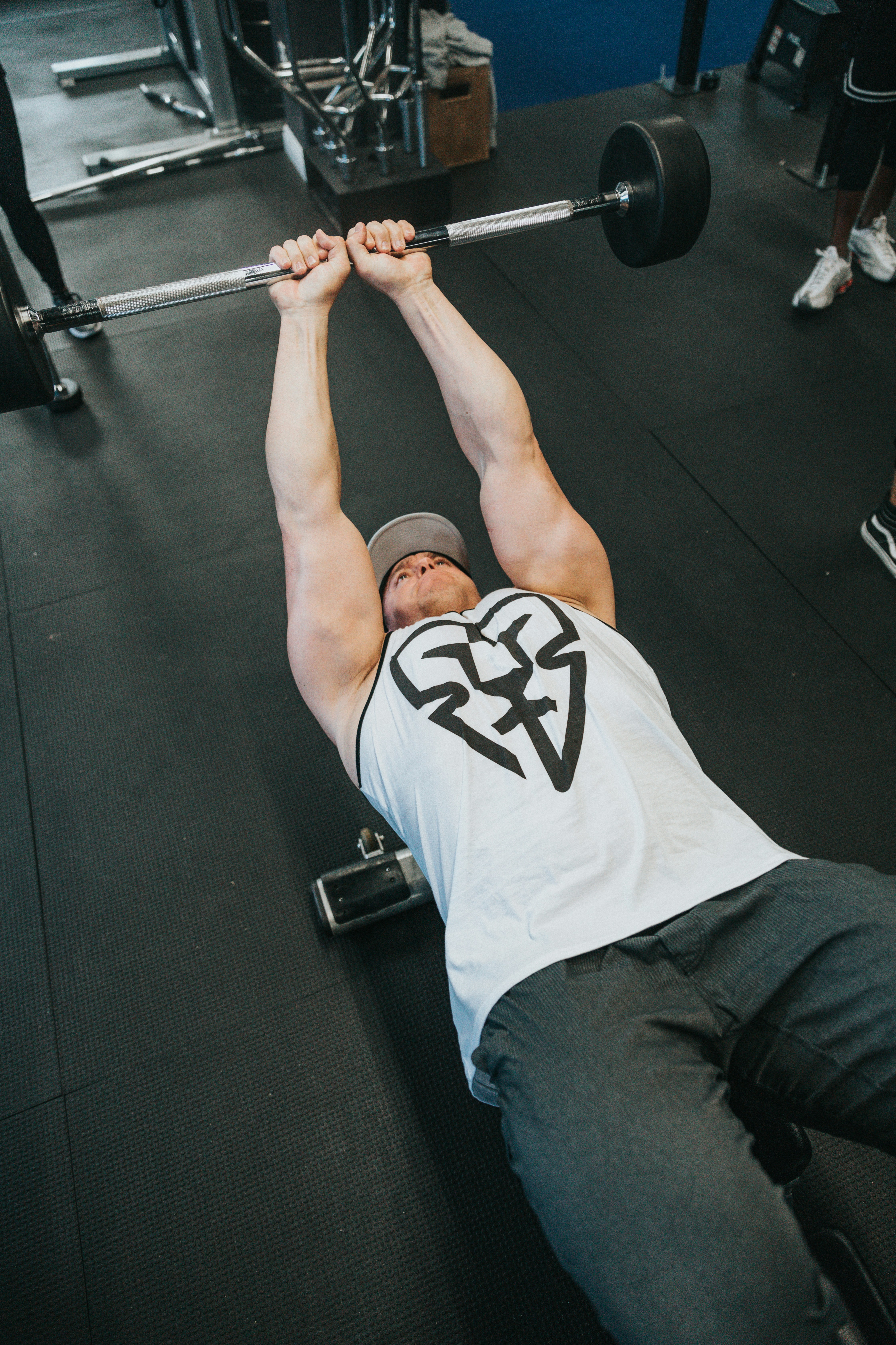 Man Lifting Barbell In Gym