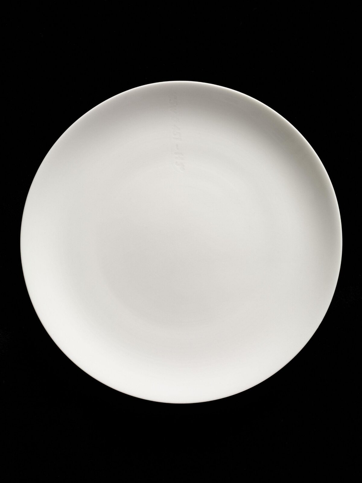 Blank White Plate on Black Background