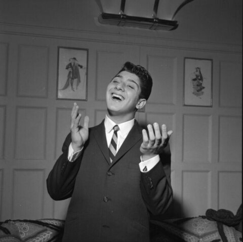 Young Man Singing In Suit