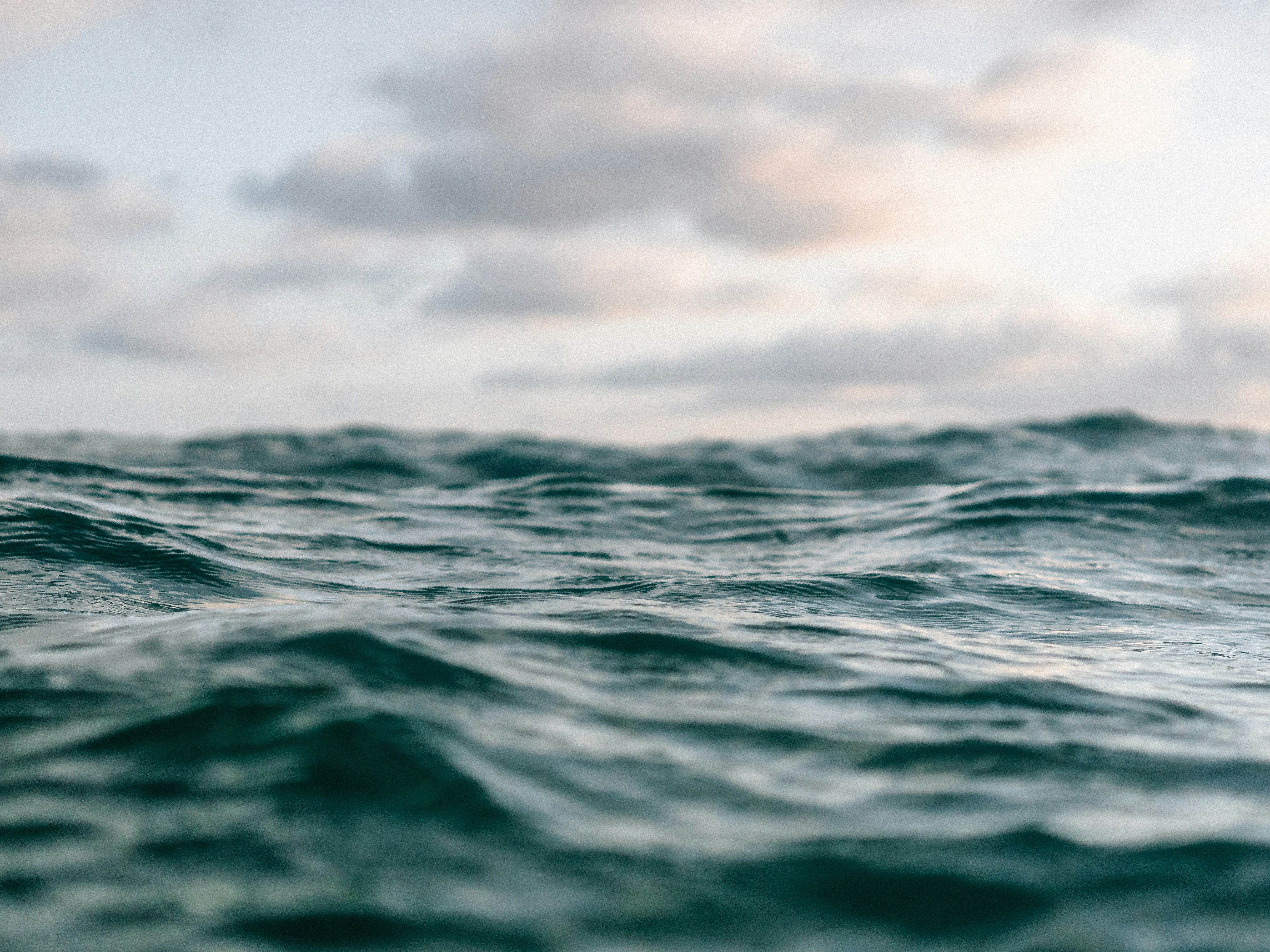 Ocean Waves Under Cloudy Sky