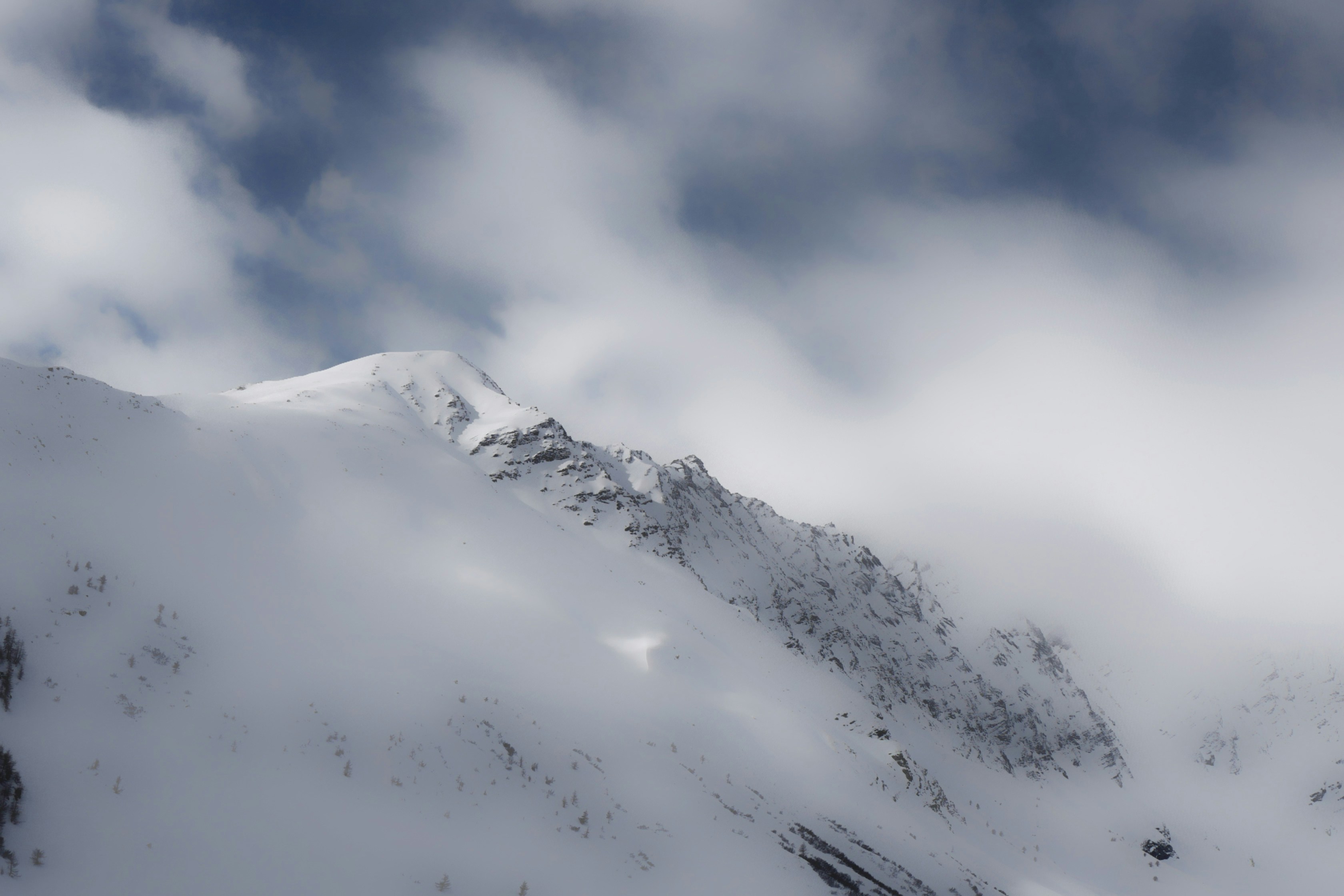 Snowy Mountain Under Cloudy Sky