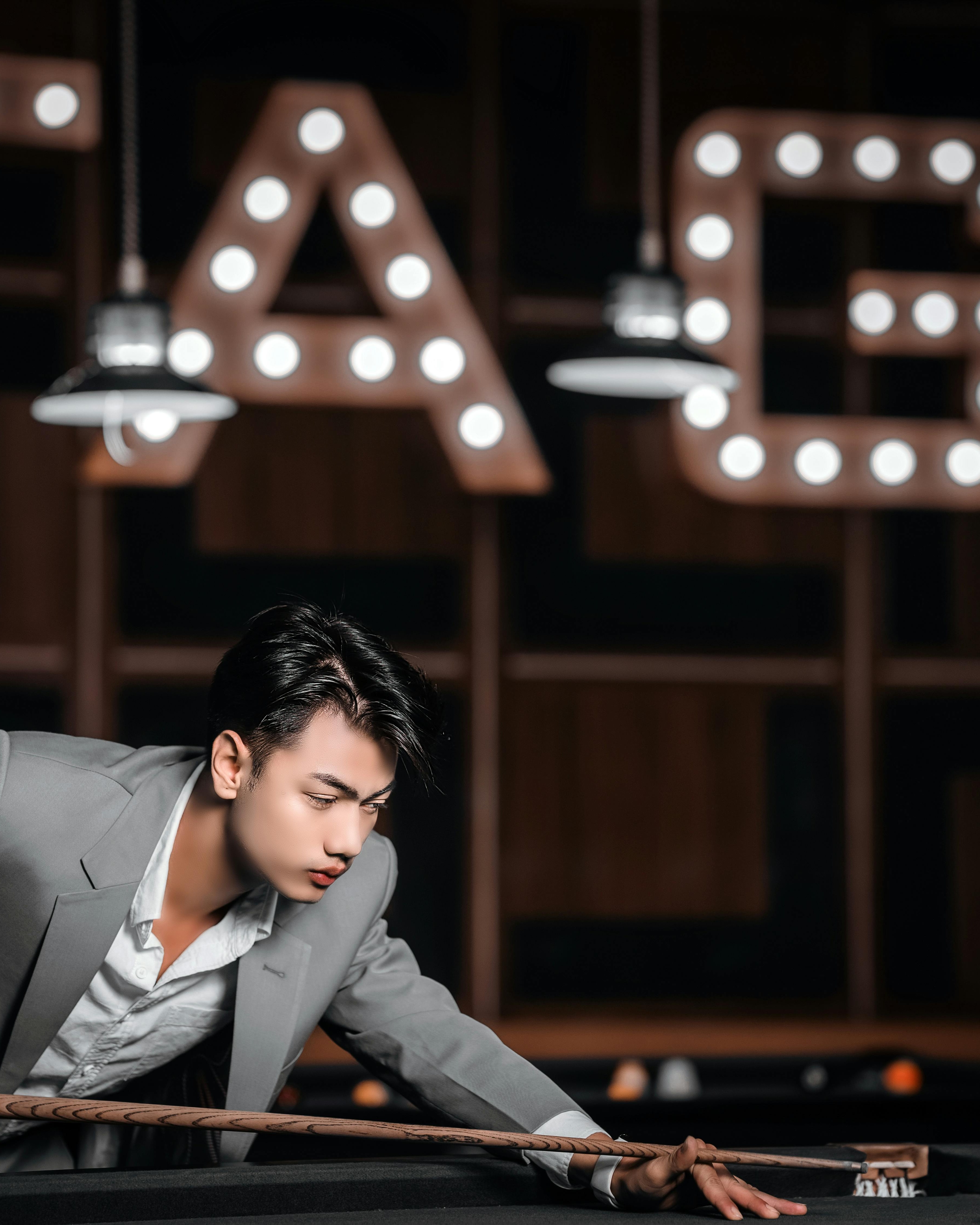 Young Man Playing Pool