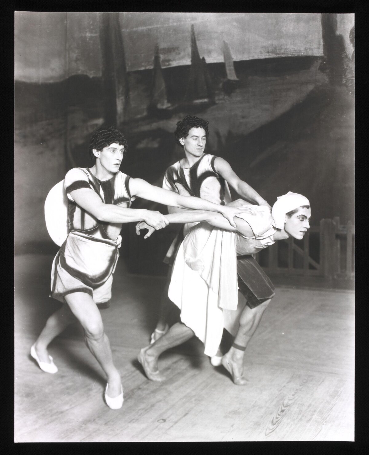 Three Dancers in Ballet Performance Pose