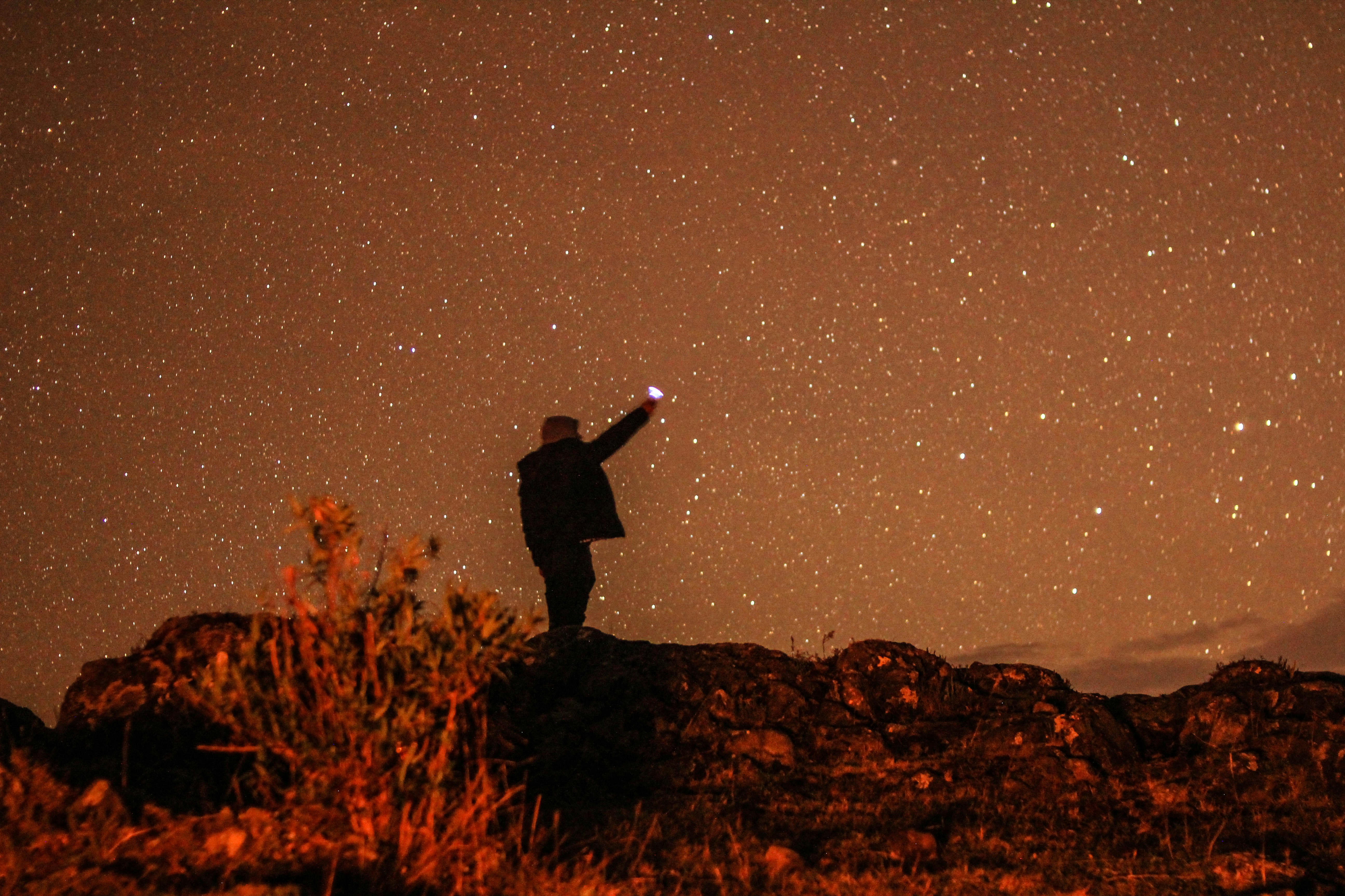 Person Reaching For Starry Night Sky