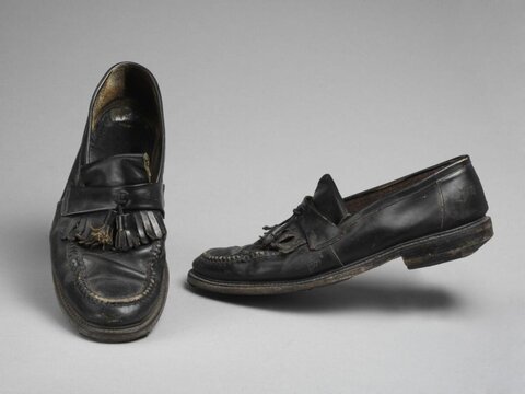 Worn Black Tassel Leather Loafers