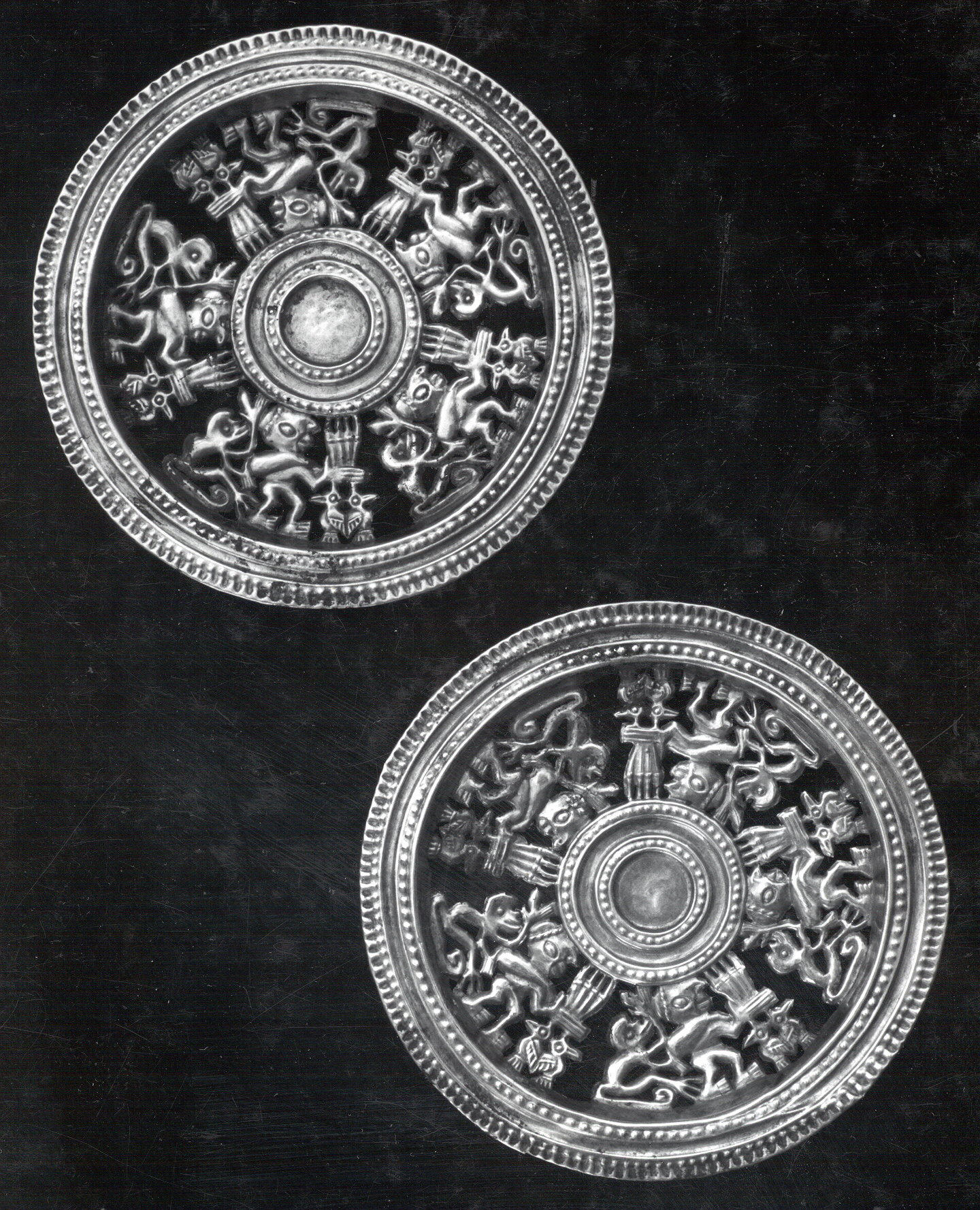 Two Openwork Silver Circular Ornaments