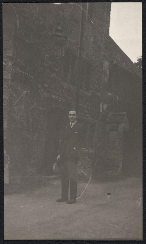 Vintage Portrait of Man by Stone Building