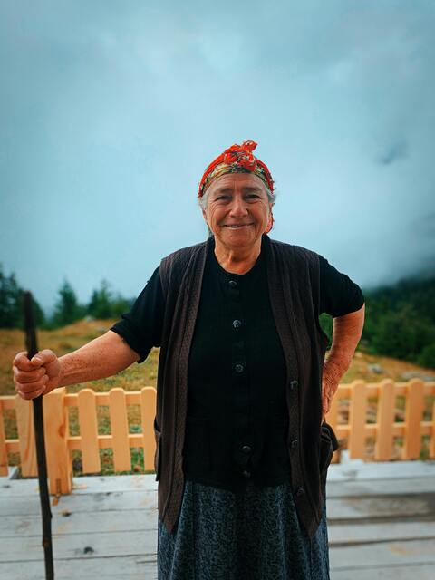 Smiling Elderly Woman With Walking Stick