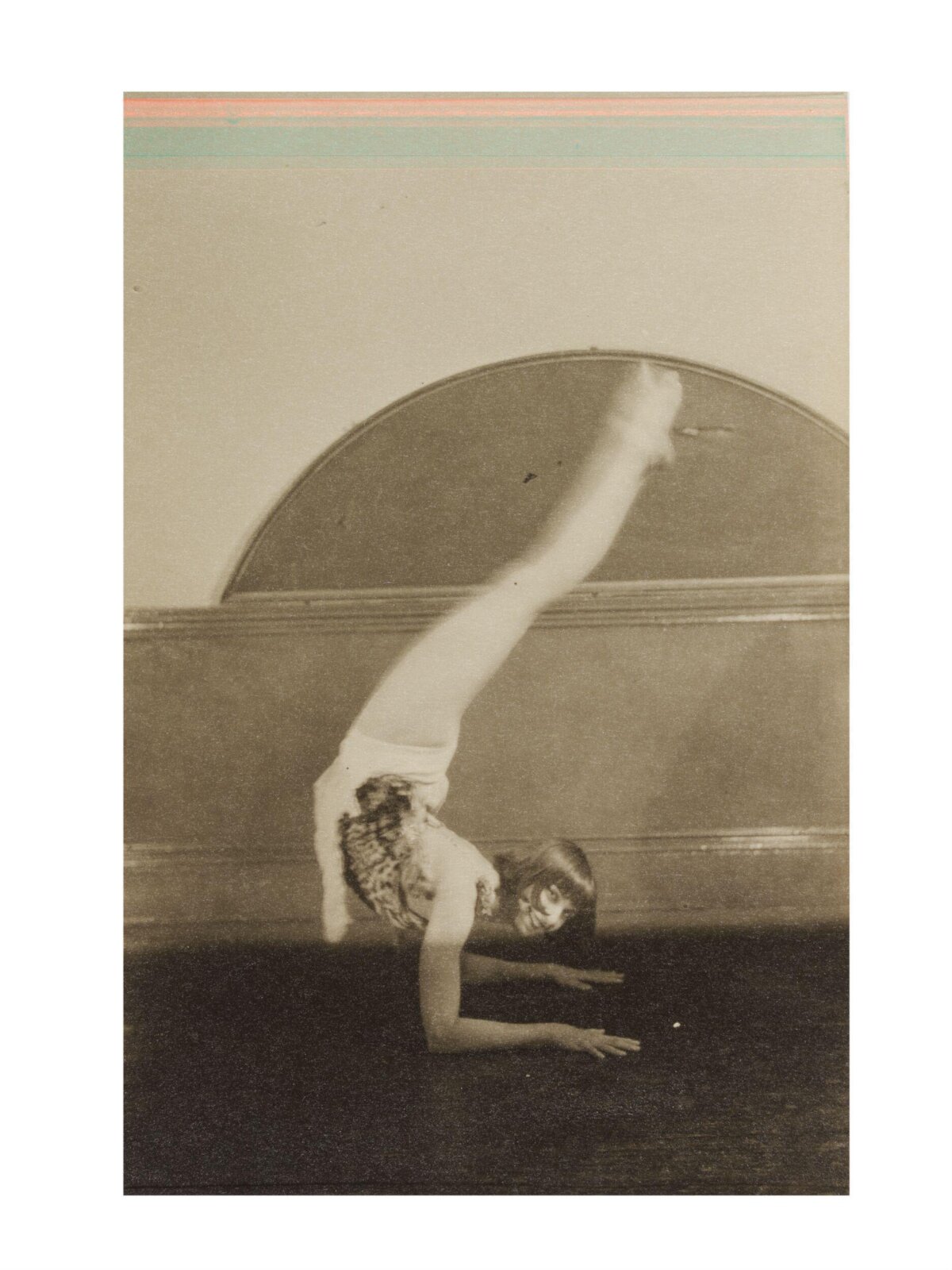 Vintage Acrobat Doing Inverted Balance Pose
