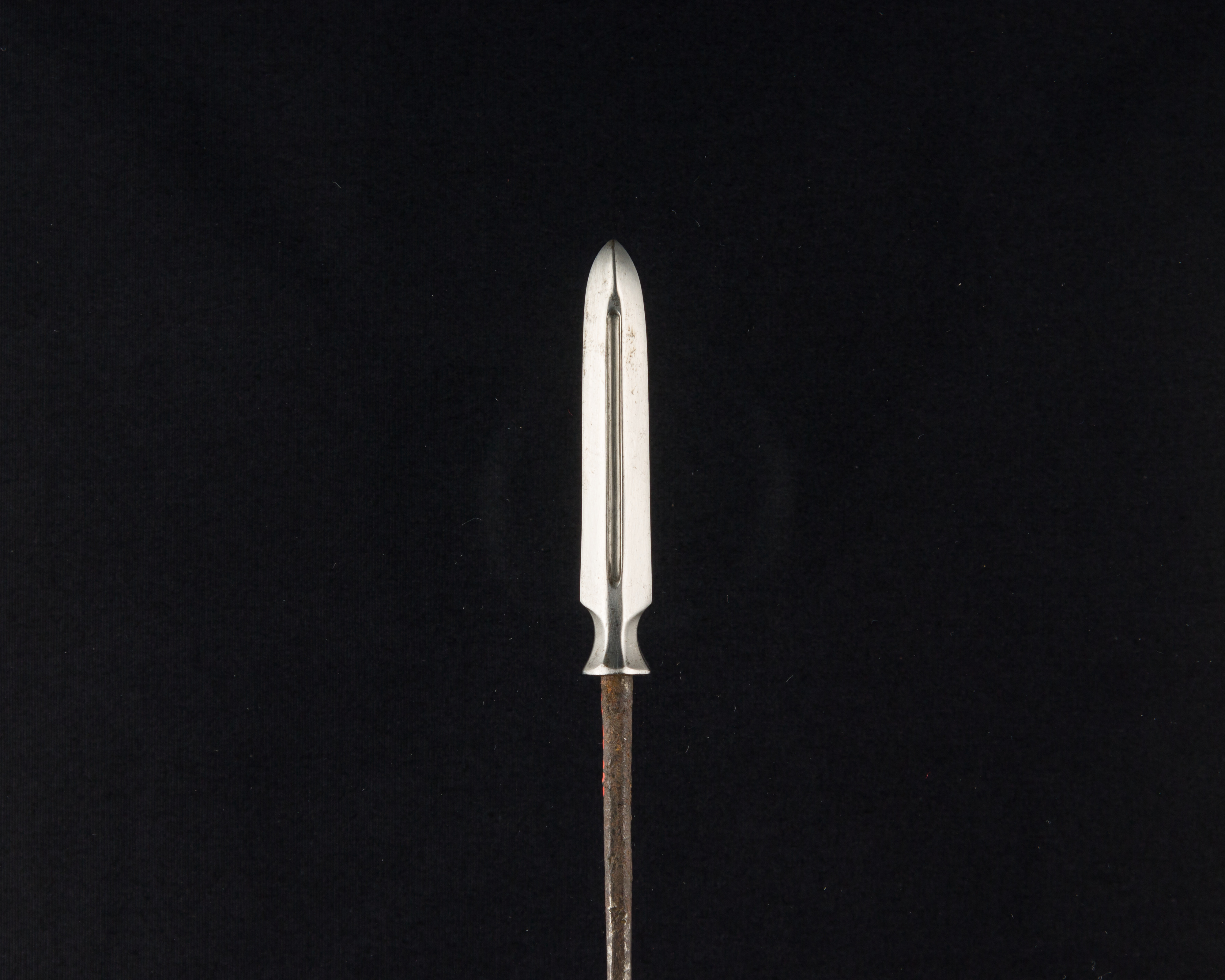 Steel Arrowhead on Rusty Shaft