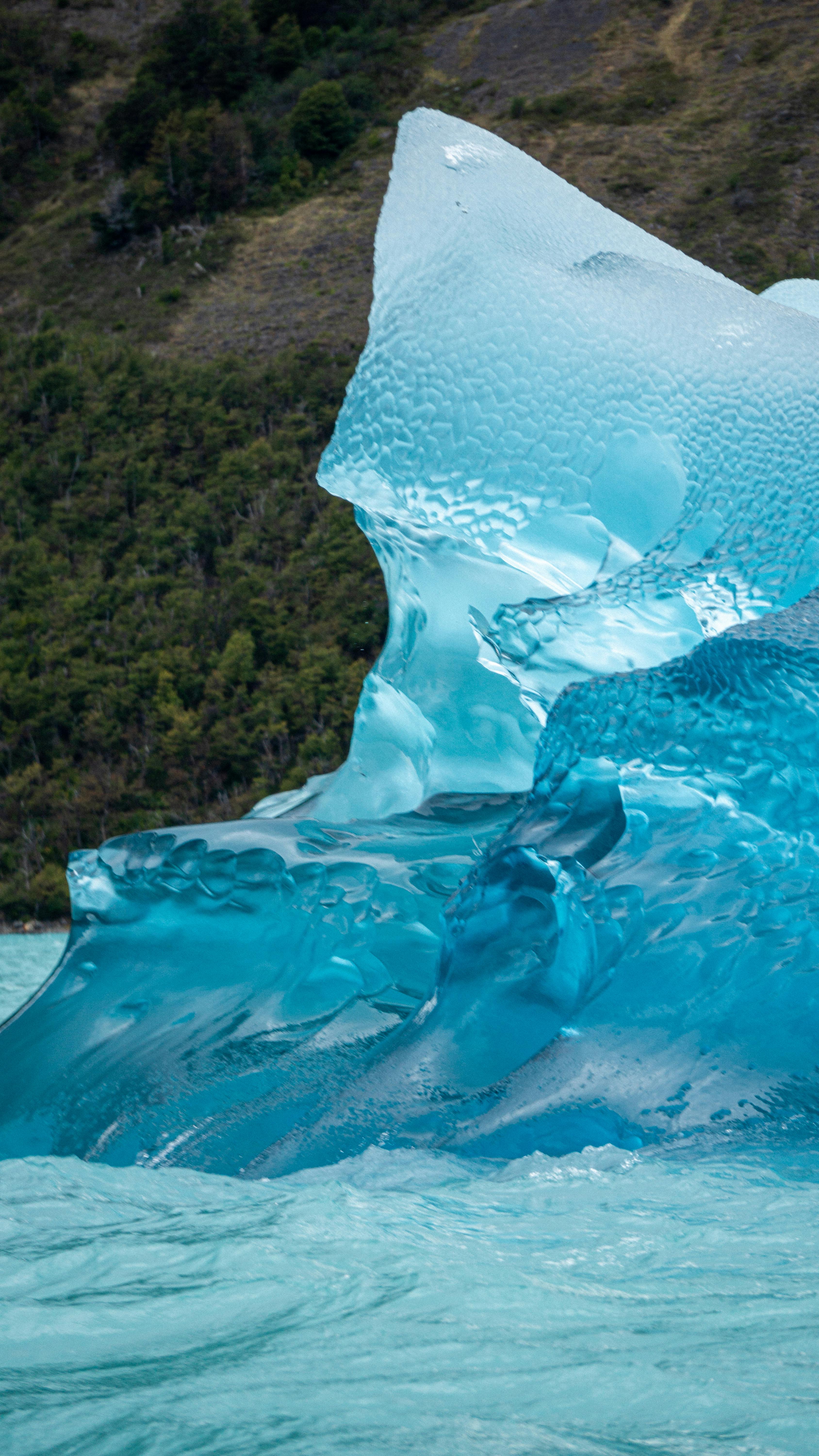 Blue Iceberg in Glacial Lake