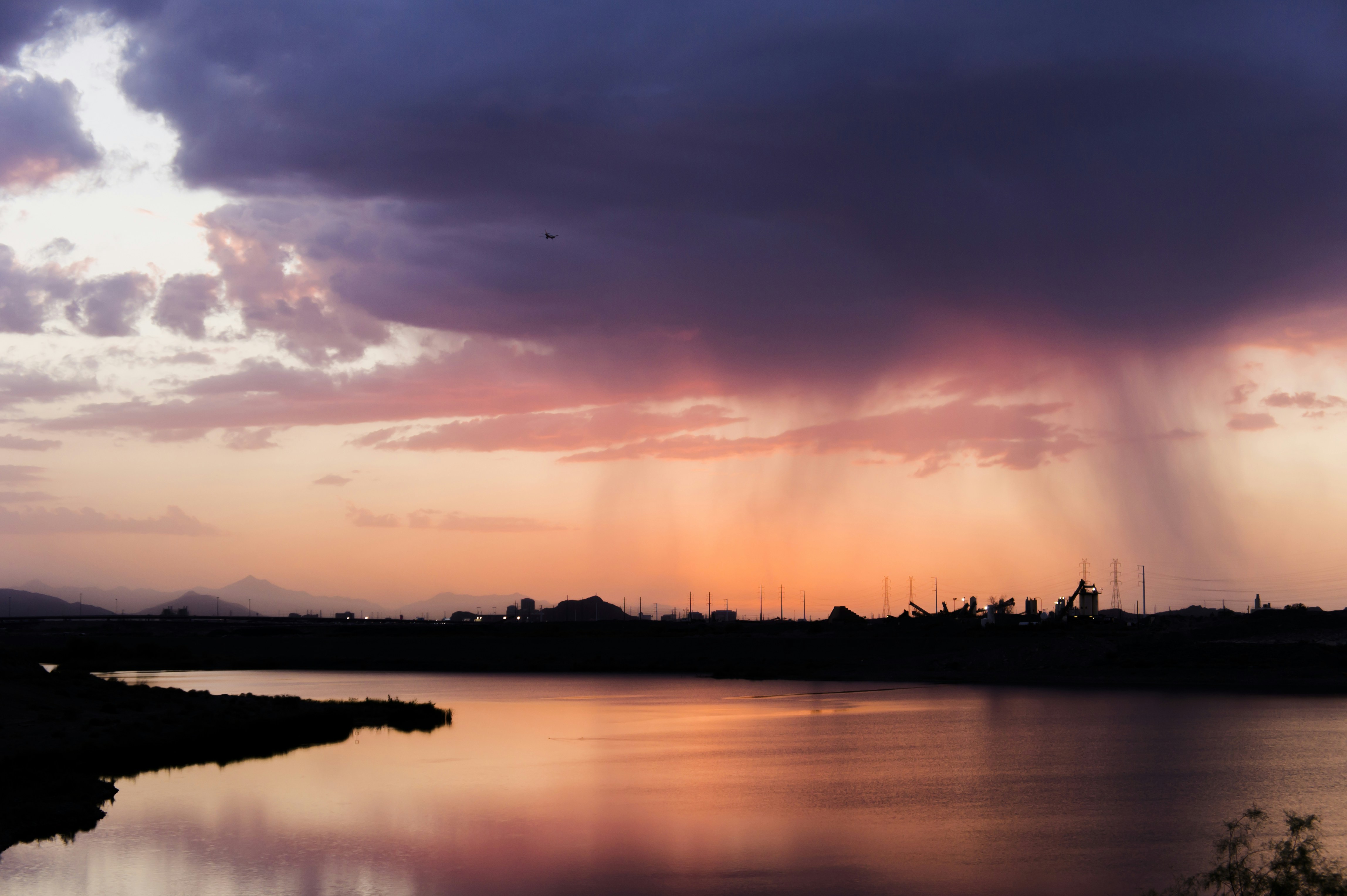 Sunset Rain Over Calm River