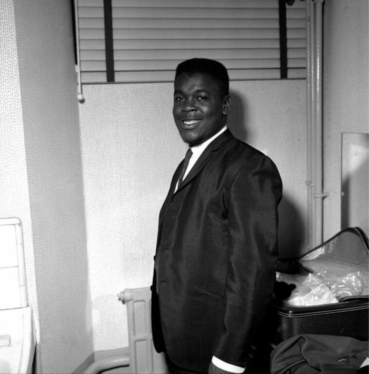 Smiling Black Man in Formal Suit