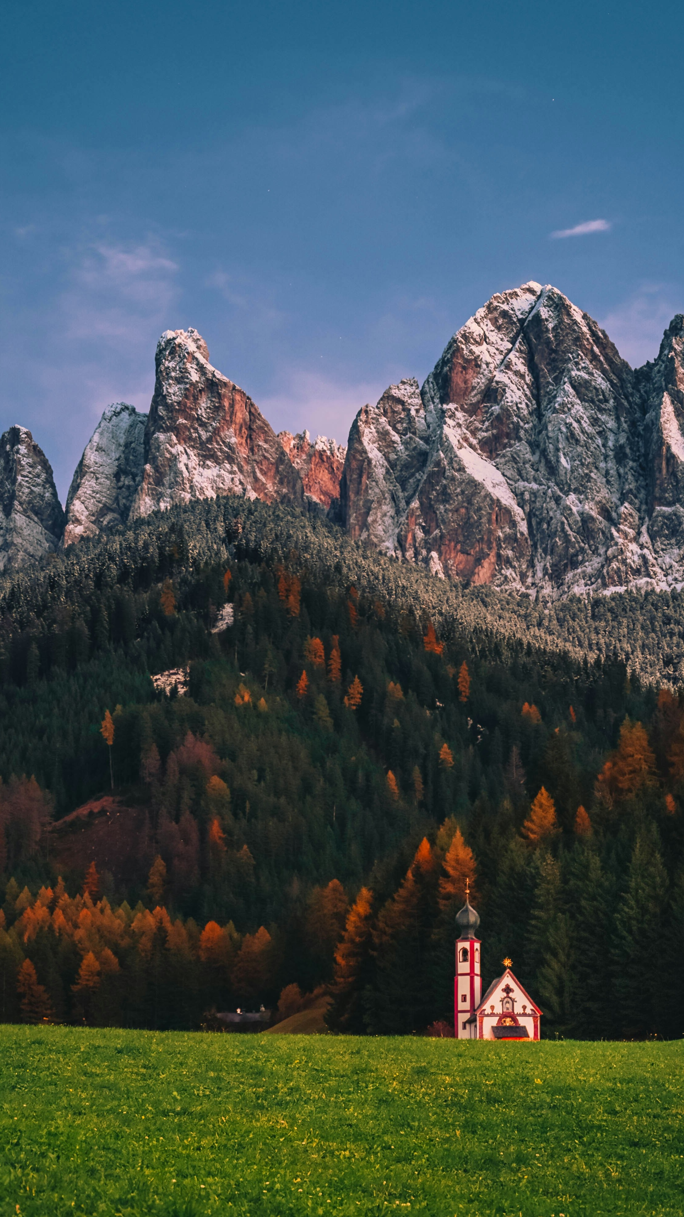 Alpine Chapel Under Snowy Peaks