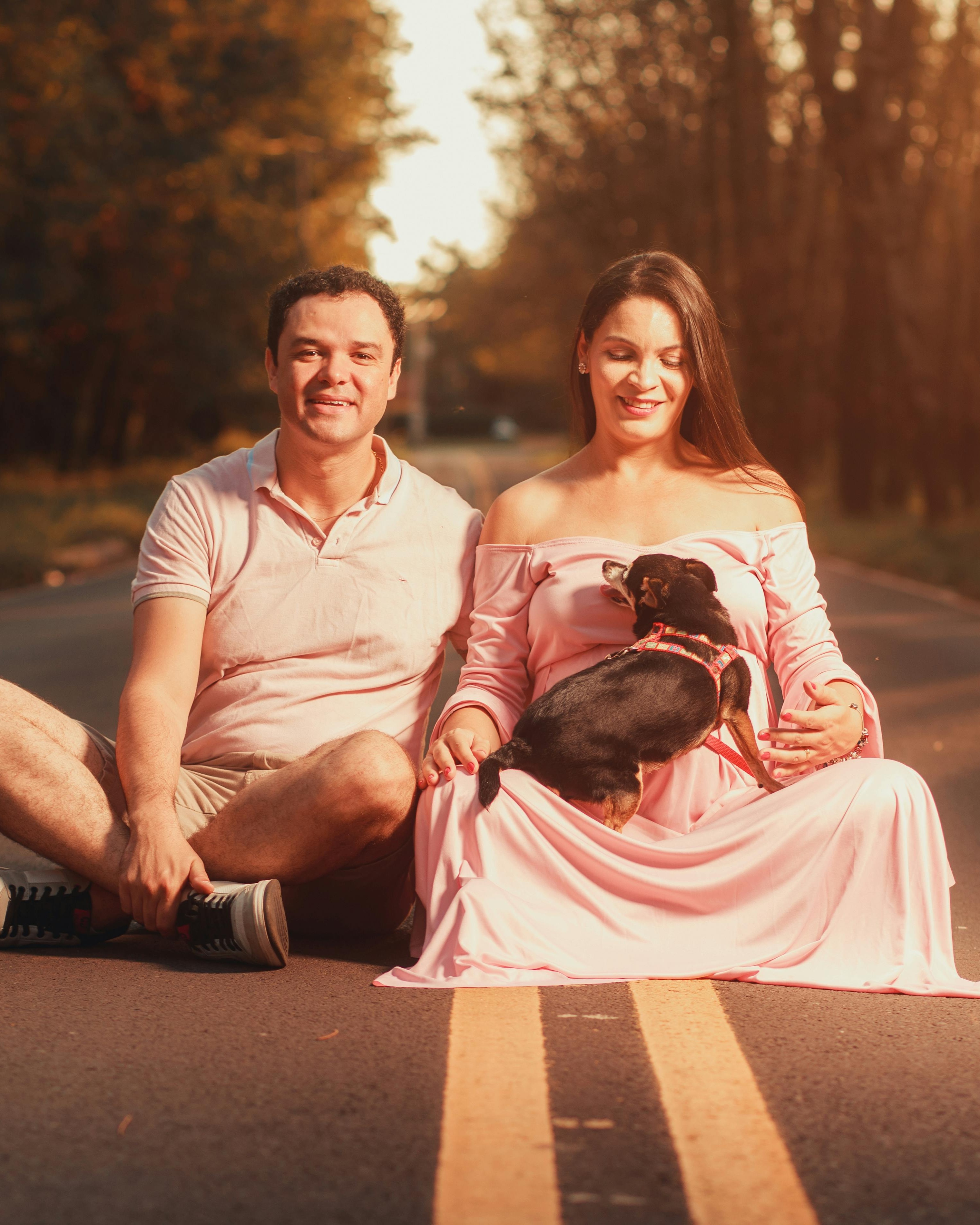Maternity Photo Of Expecting Couple With Dog