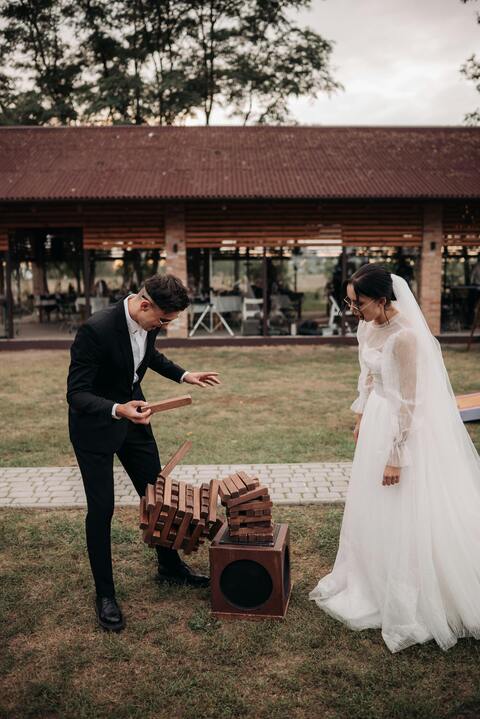Bride and Groom Play Giant Jenga at Wedding