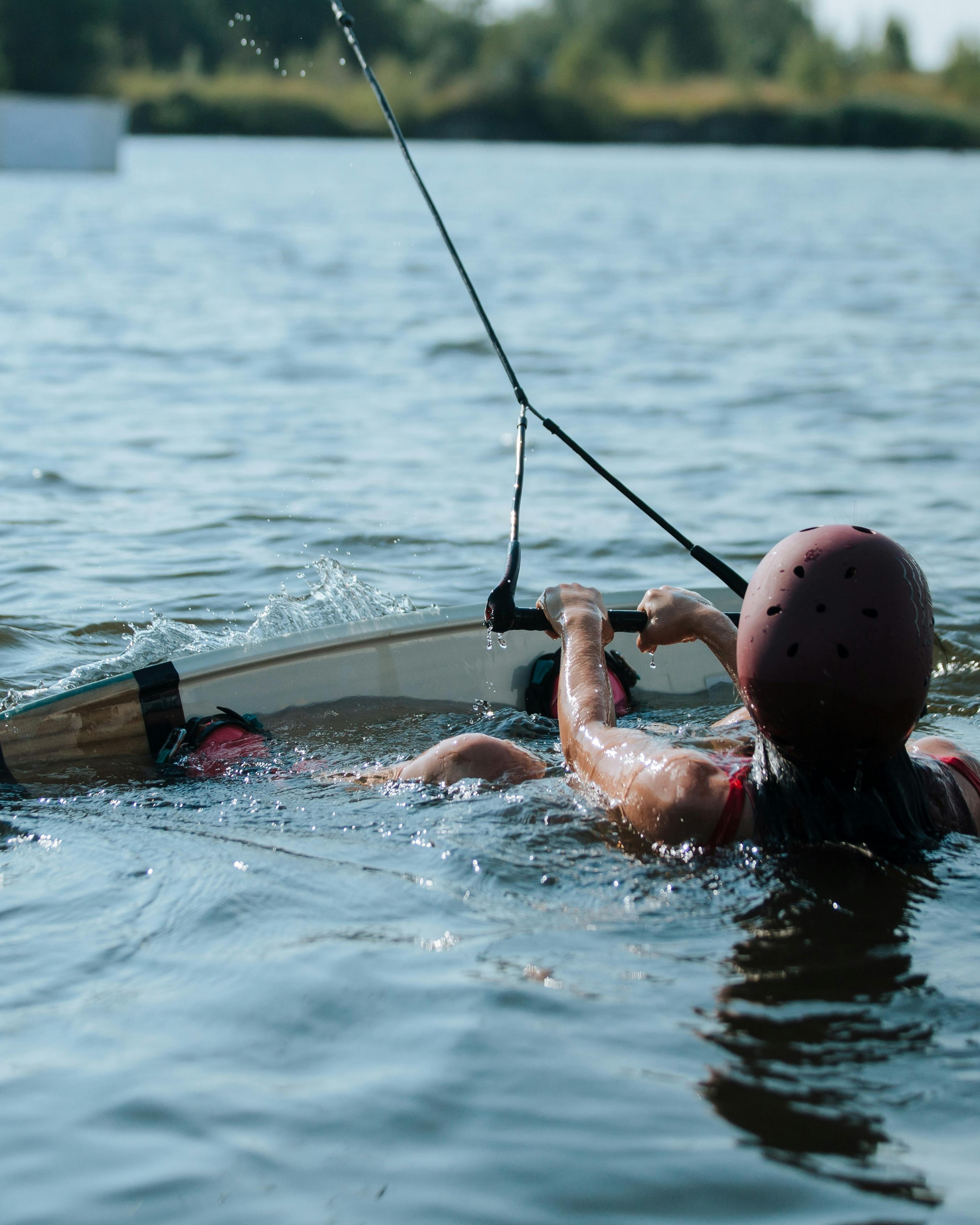 Wakeboarder Holding Tow Rope in Water