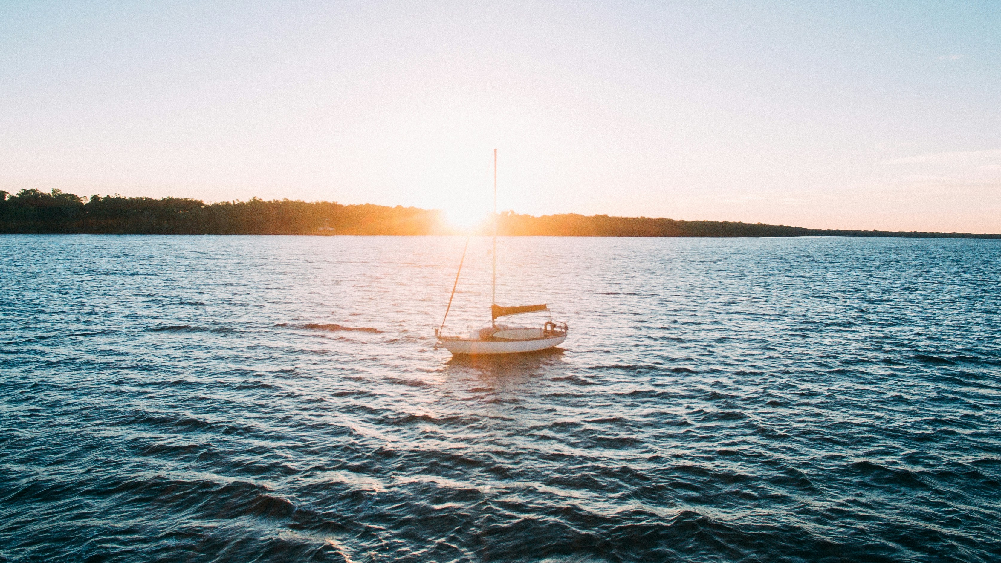 Sailboat on Lake at Sunset
