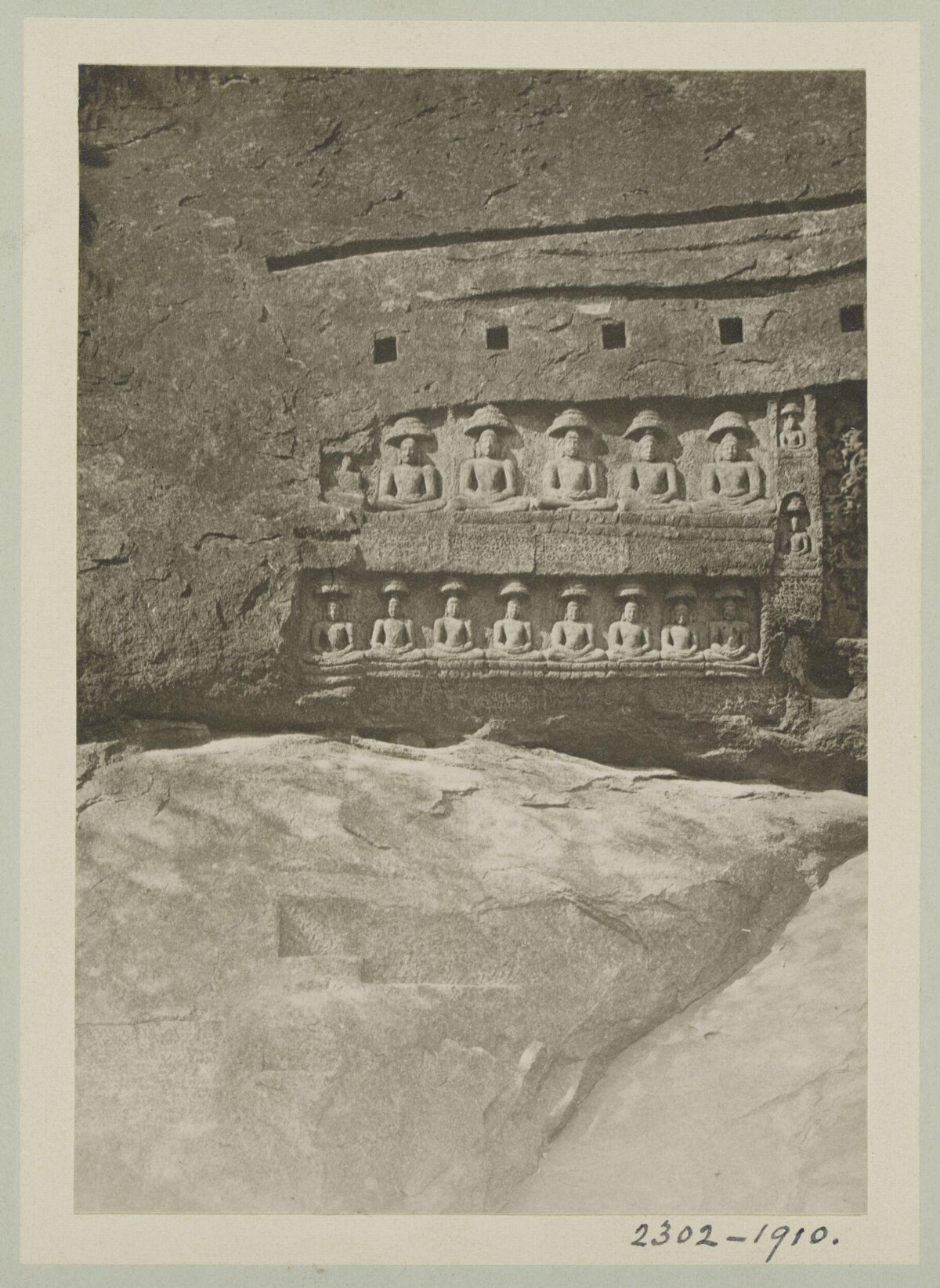 Ancient Rock Carvings of Seated Figures