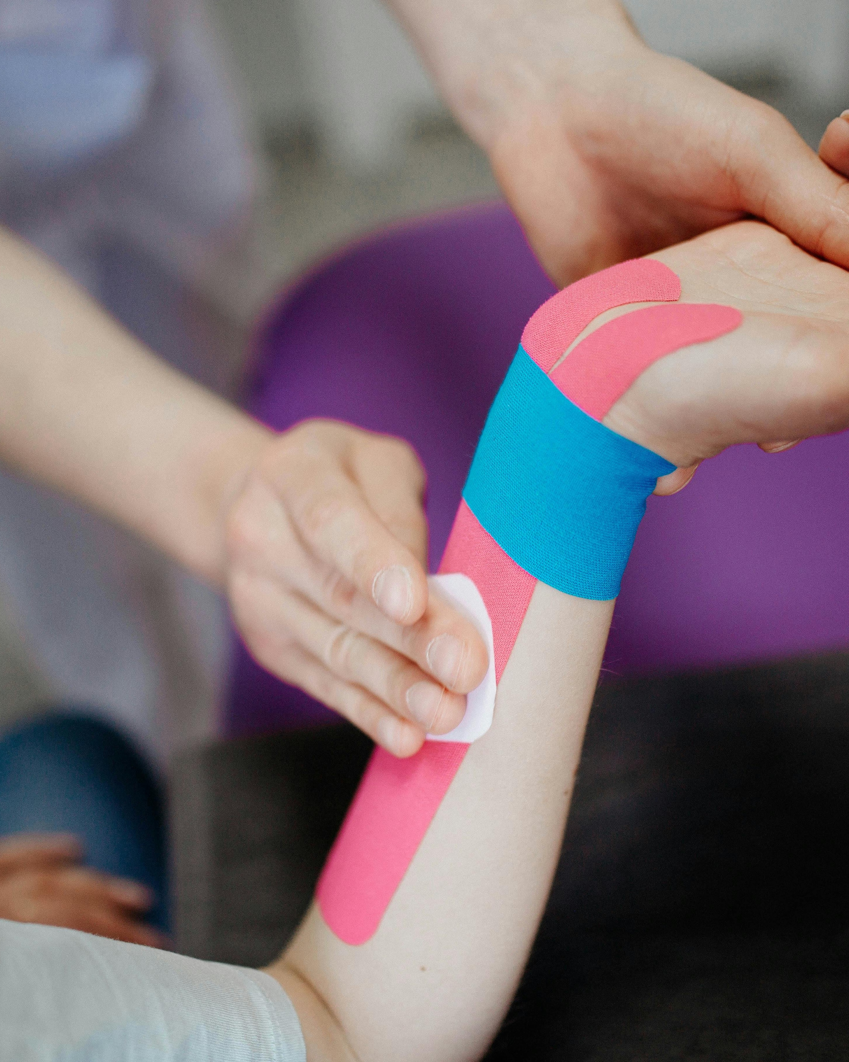 Applying Kinesio Tape to Patient Forearm