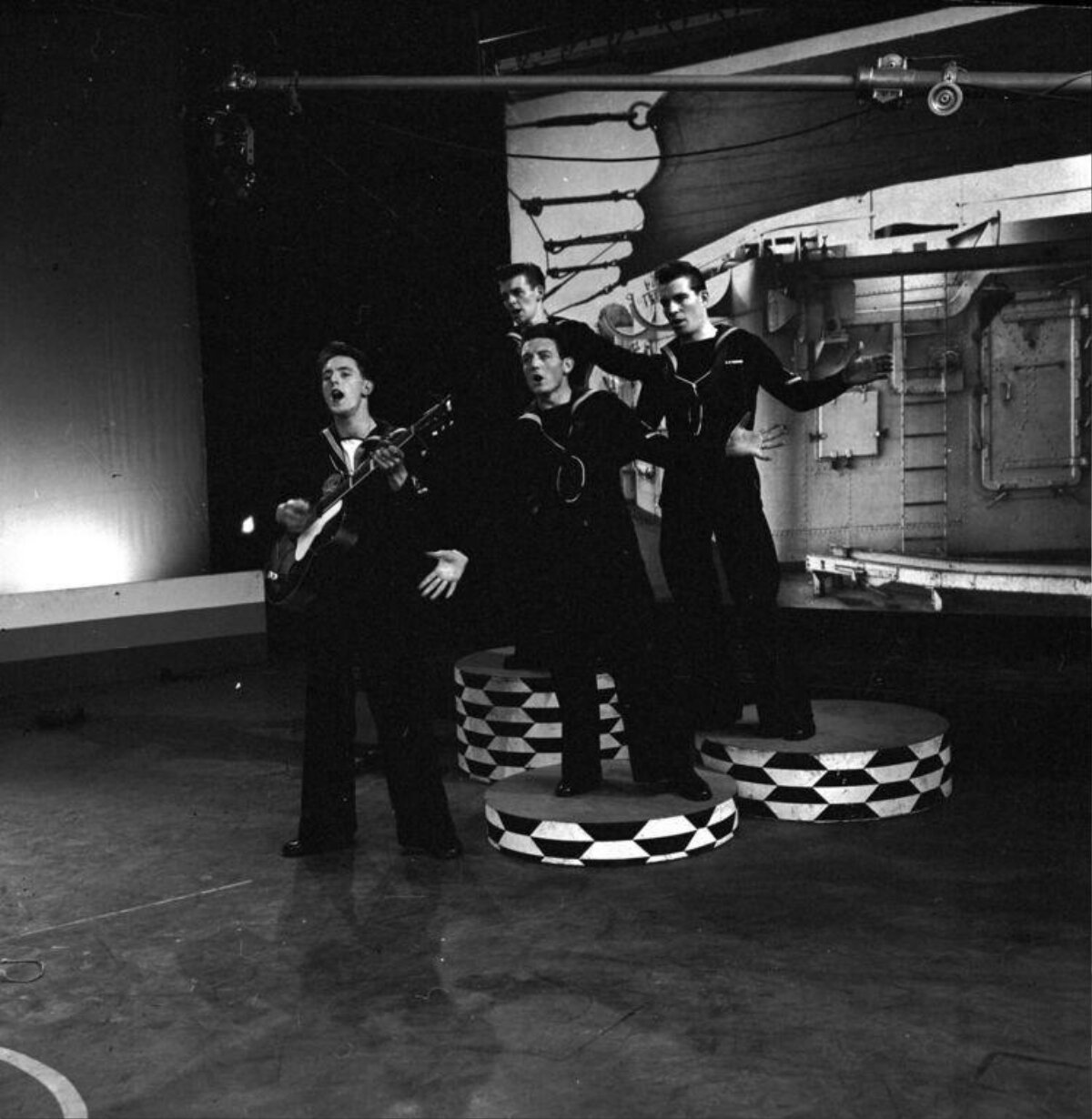 Four Sailors Performing On Stage
