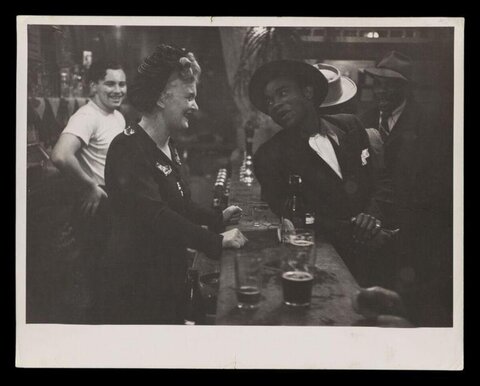 People Chatting at Bar Counter