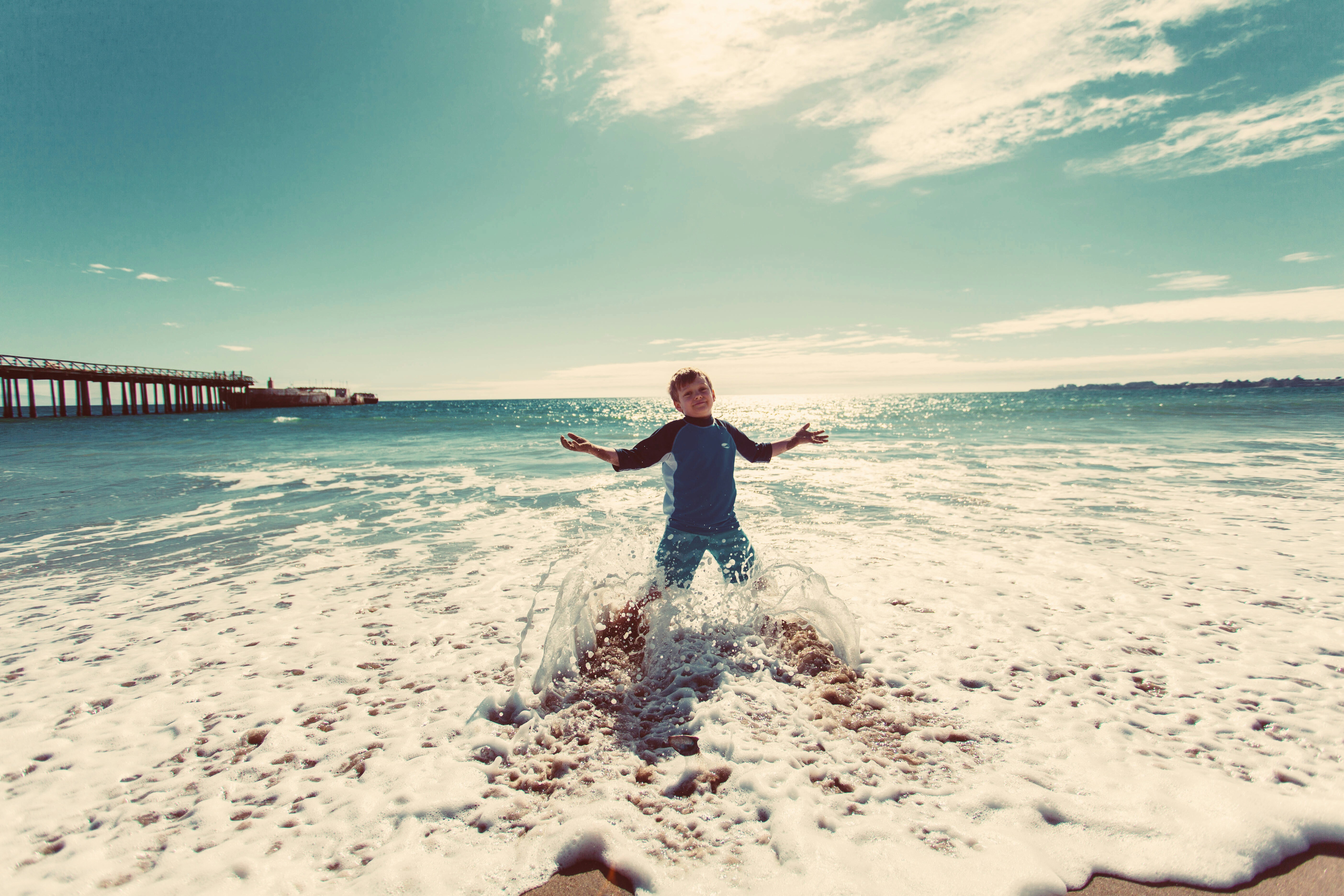 Boy Playing in Beach Surf