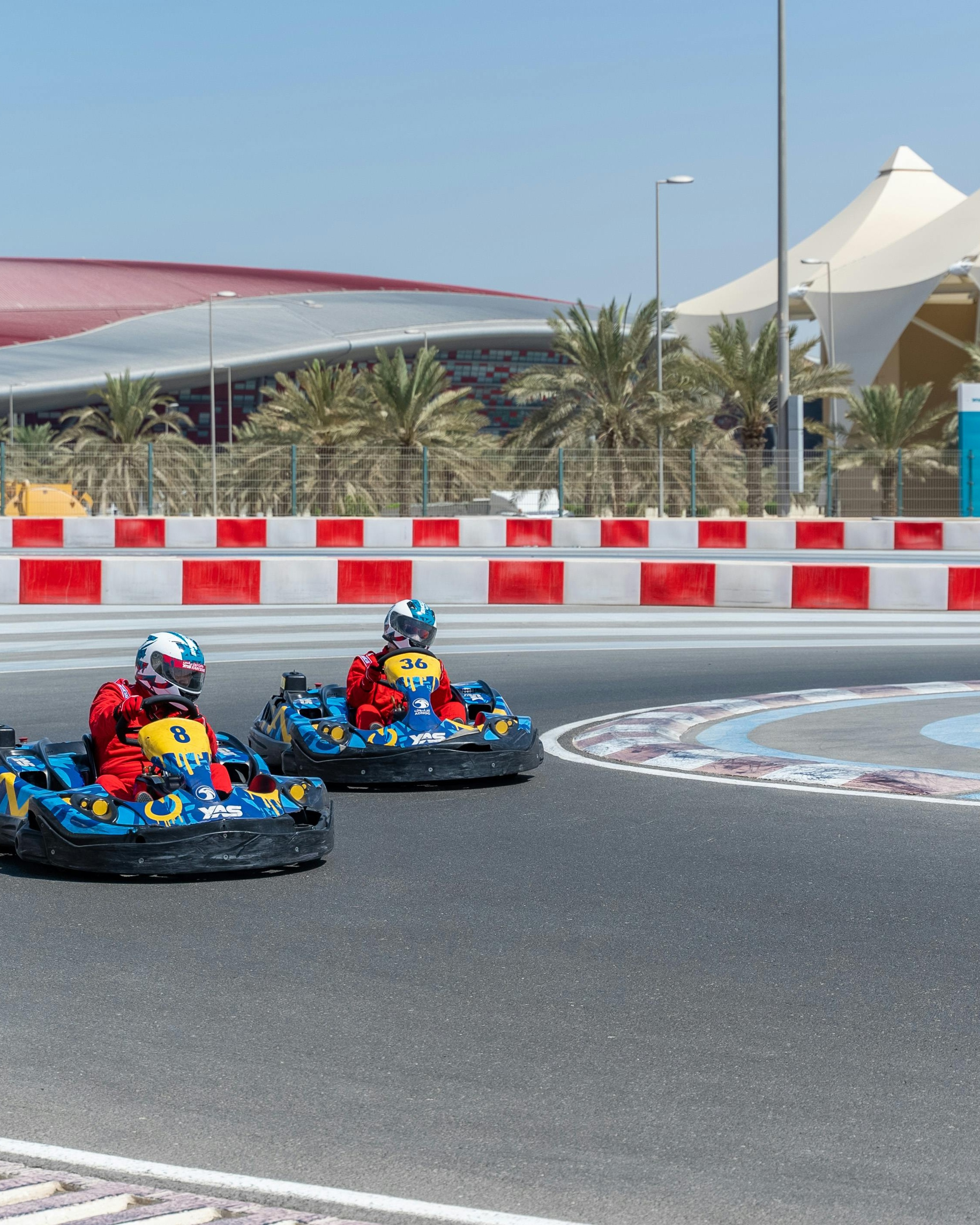 Two Go-Karters Racing on Track
