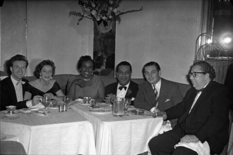 Six People Dining At Restaurant