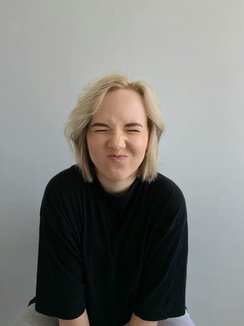 Woman Making a Funny Squinting Face