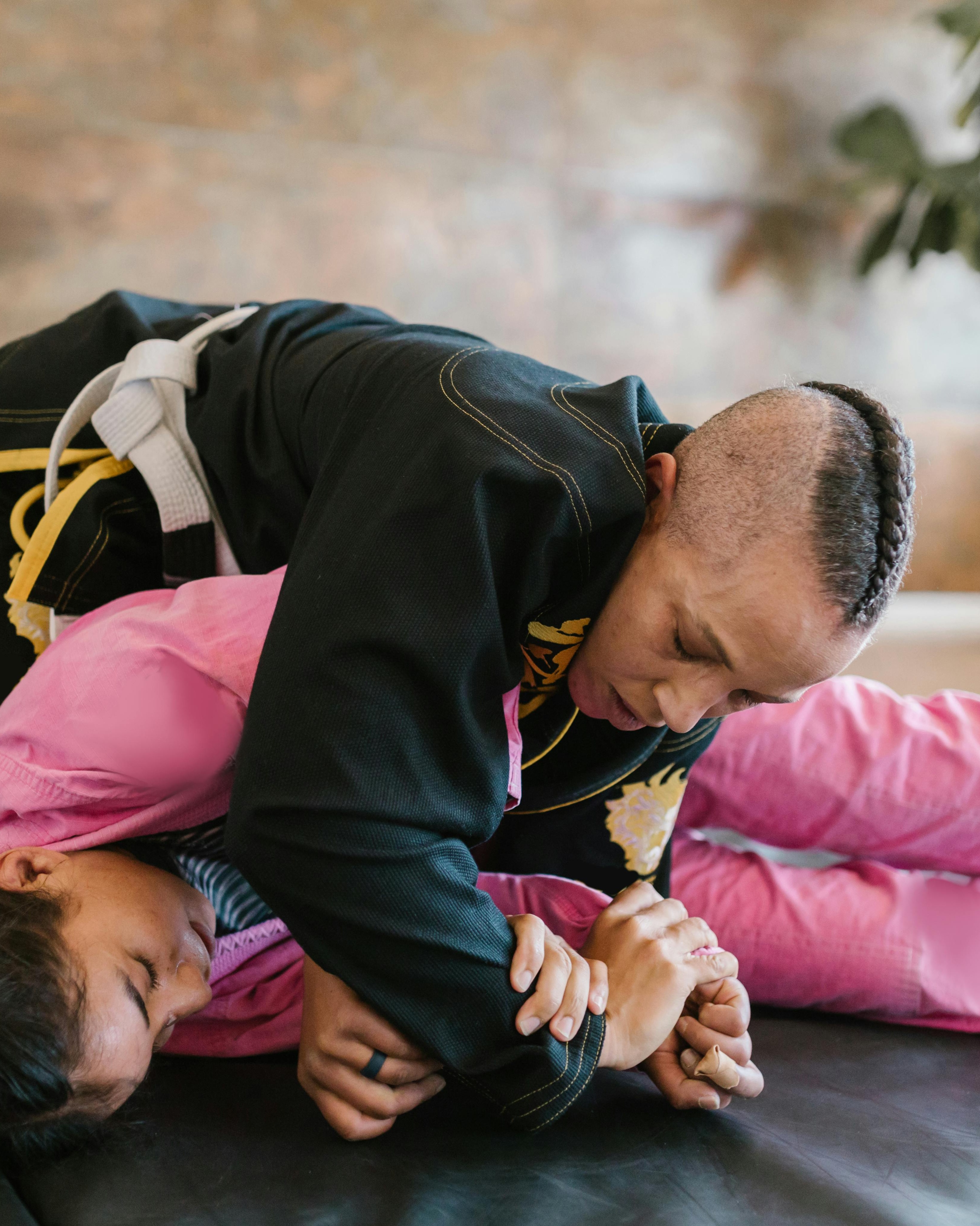 Two People Practicing Jiu Jitsu