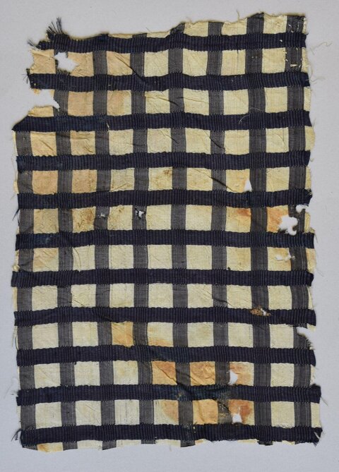 Damaged Checkered Textile Fragment