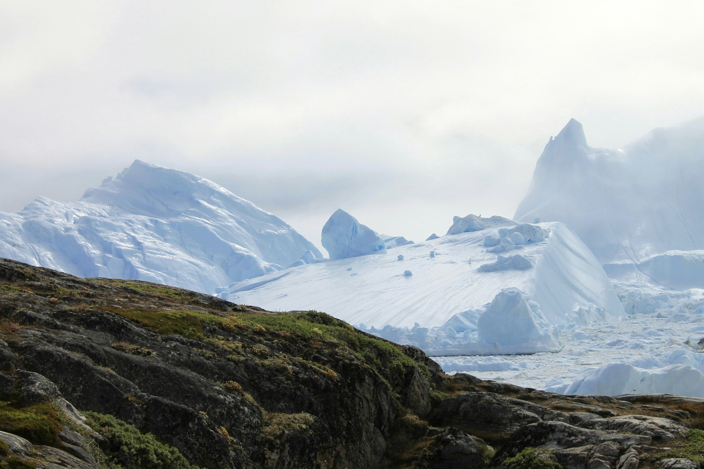 Massive Glaciers by Rocky Shore