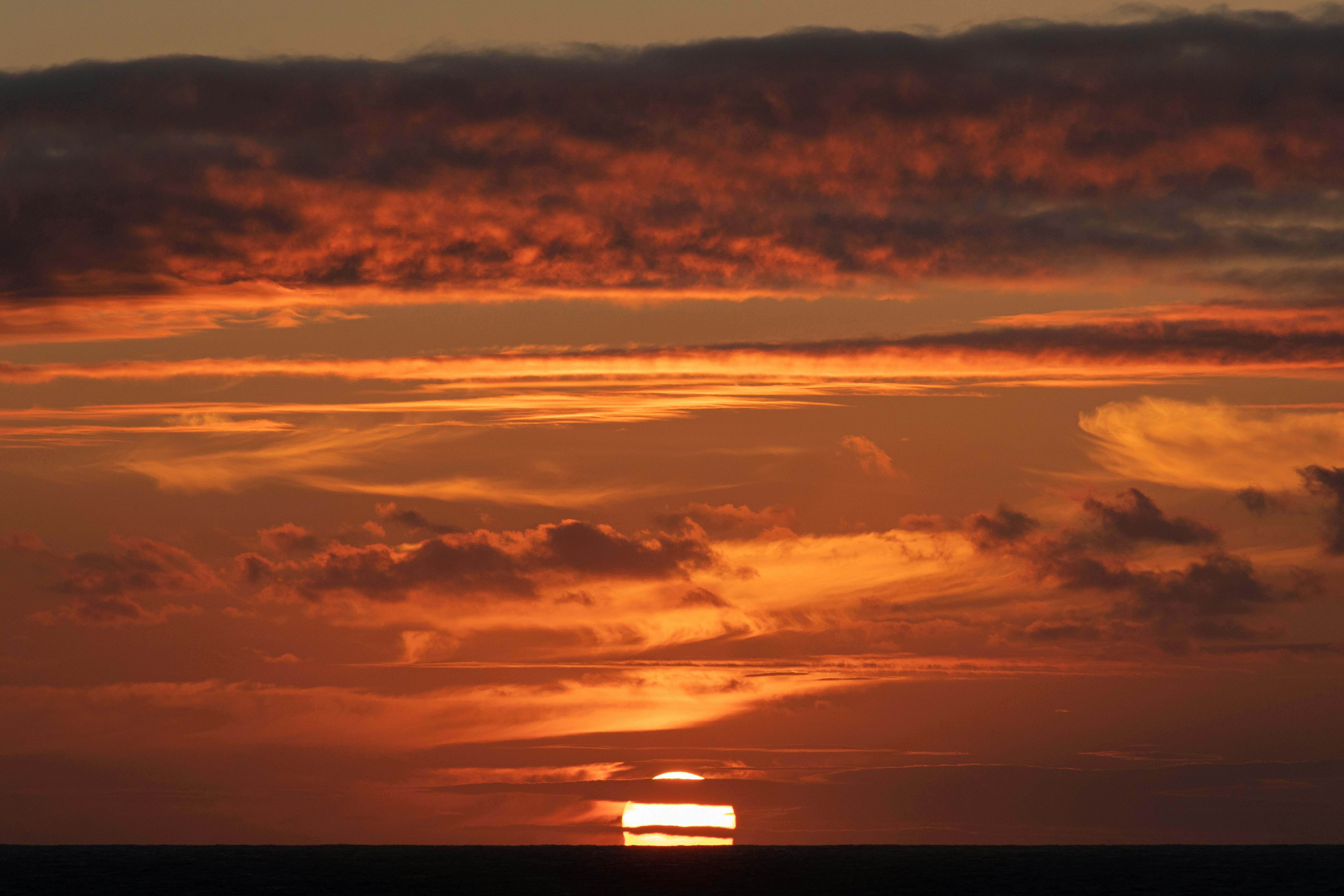 Sunset Over Ocean Horizon