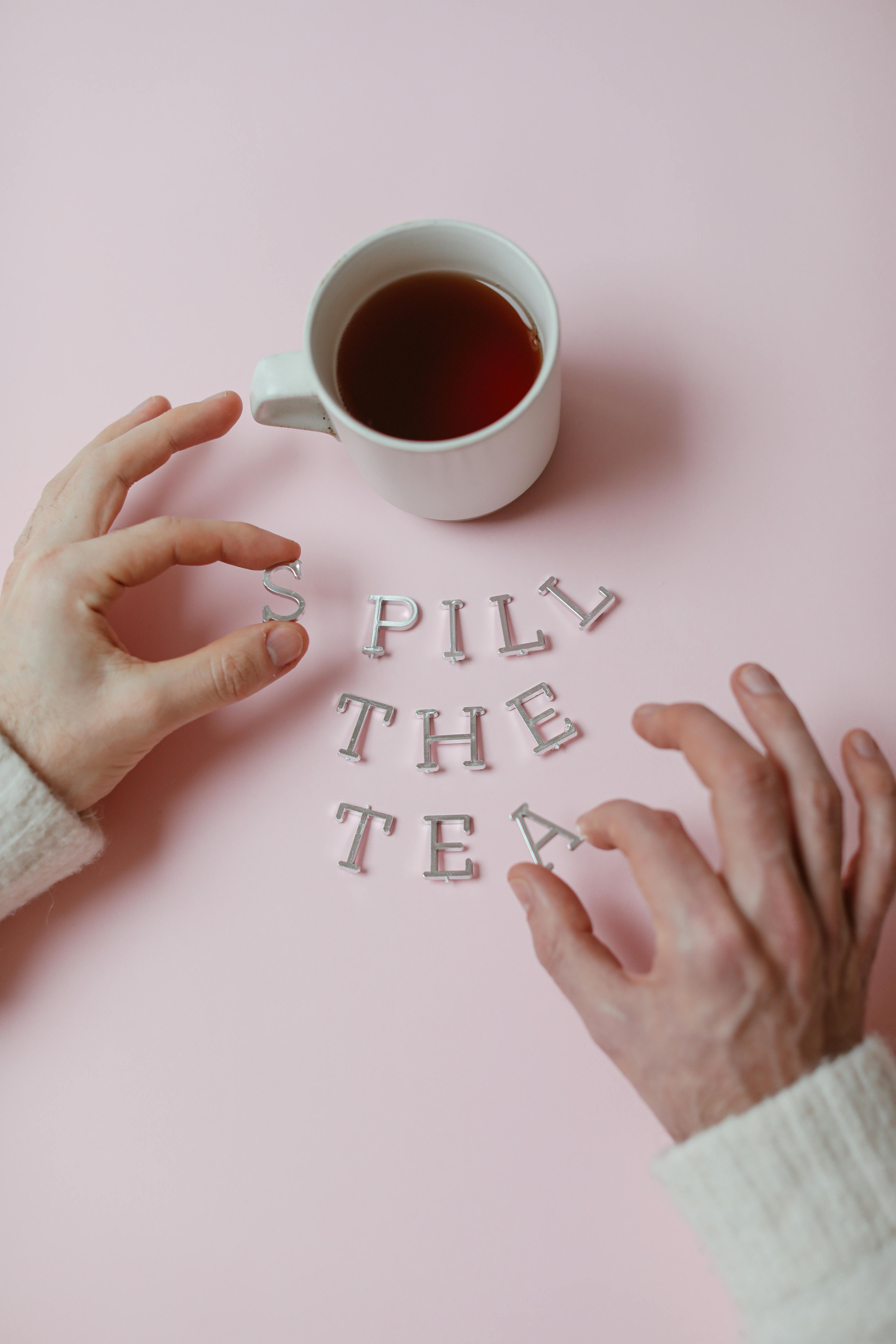 Hands Spelling Spill The Tea With Tea Mug