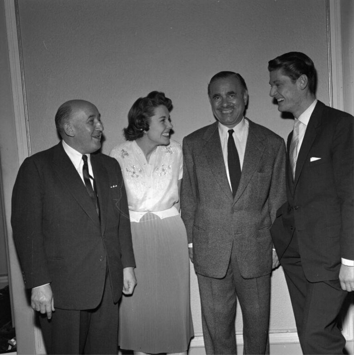 Four Formally Dressed People Group Photo