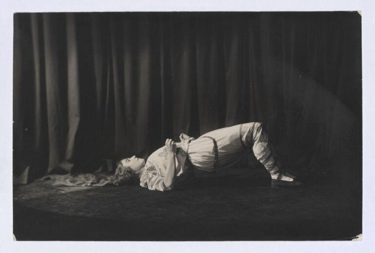 Woman Performing Bridge Pose on Stage