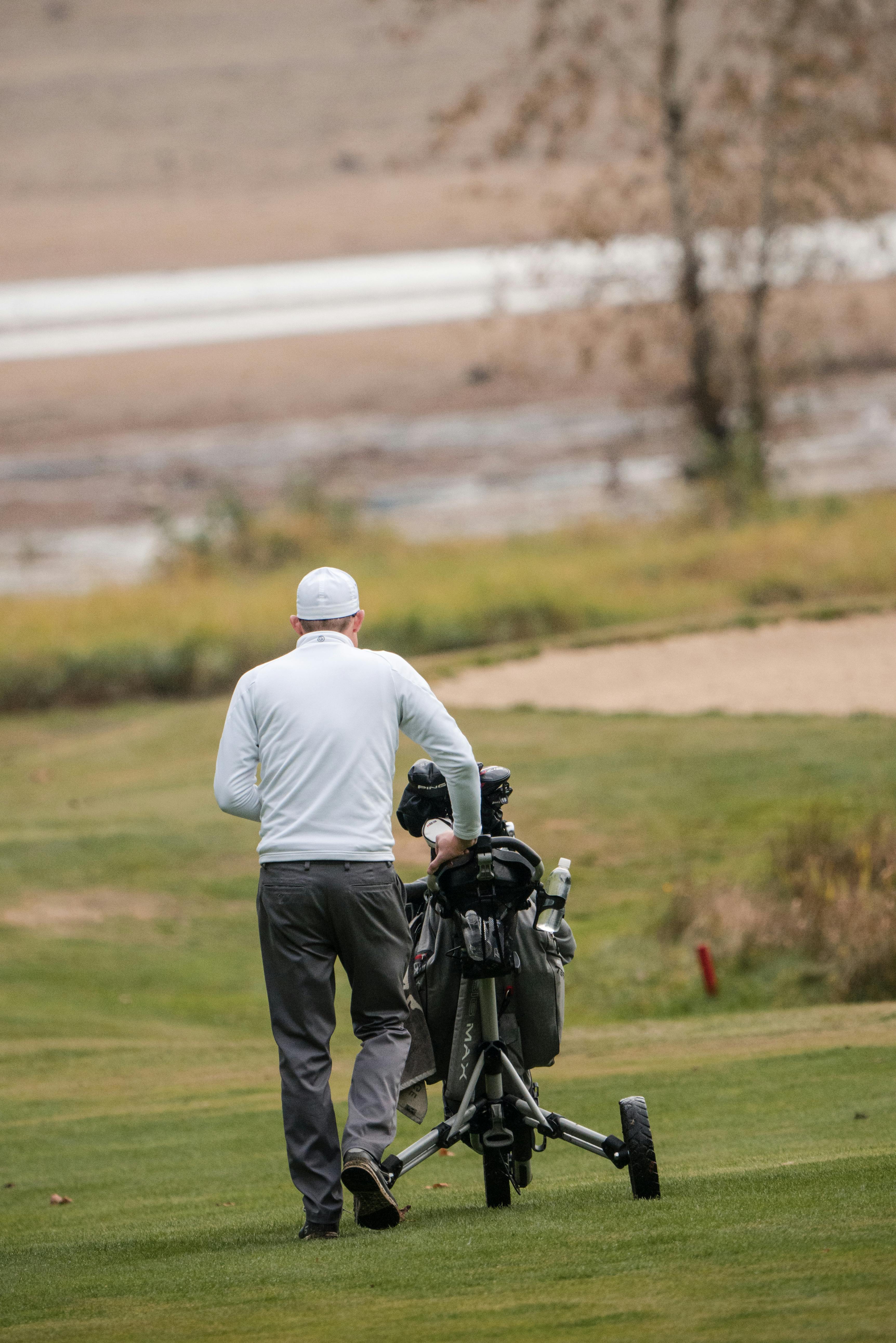 Golfer Walking on Golf Course