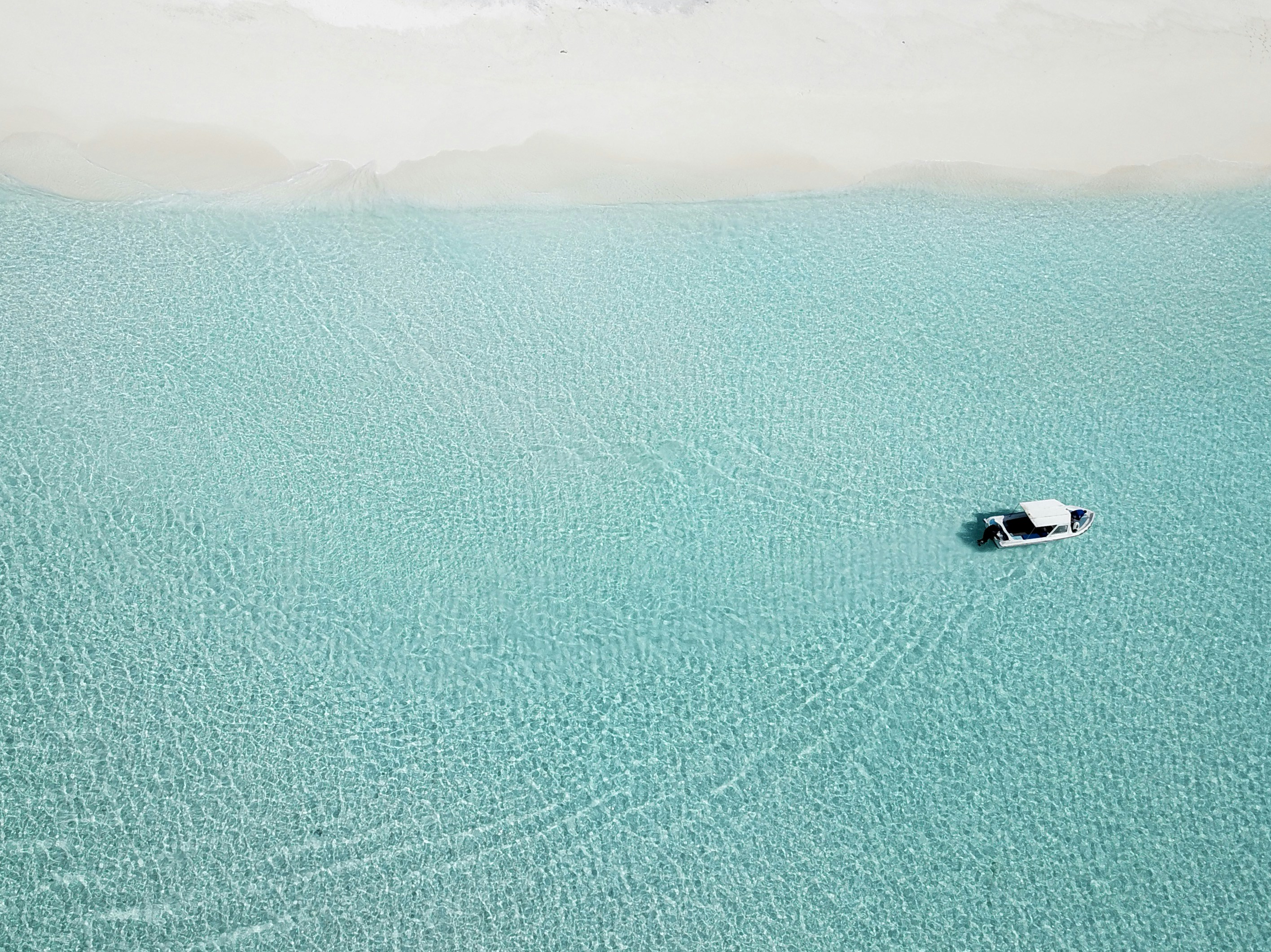 Aerial View of Boat on Turquoise Sea
