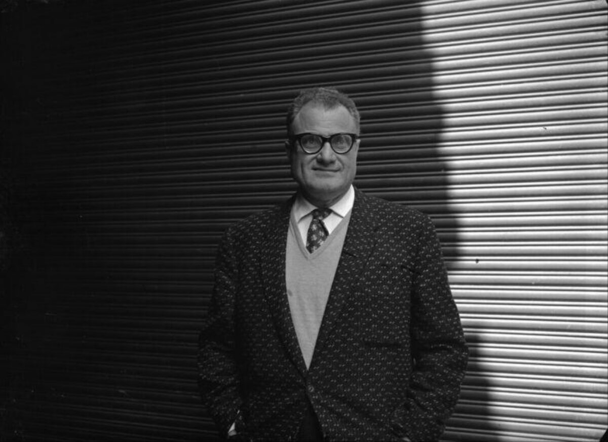 Portrait of Middle-aged Man Against Shutter