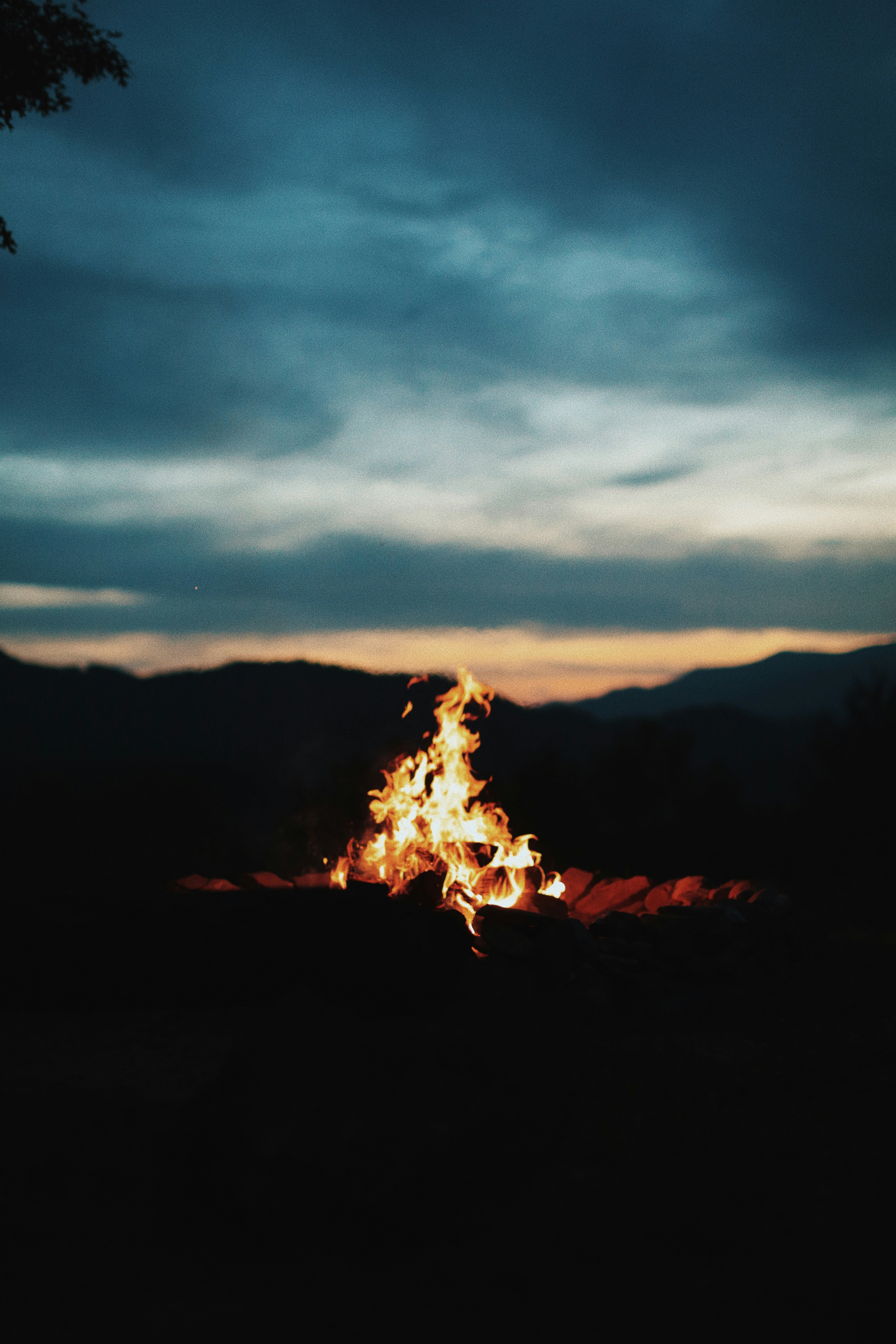 Campfire at Dusk by Mountains