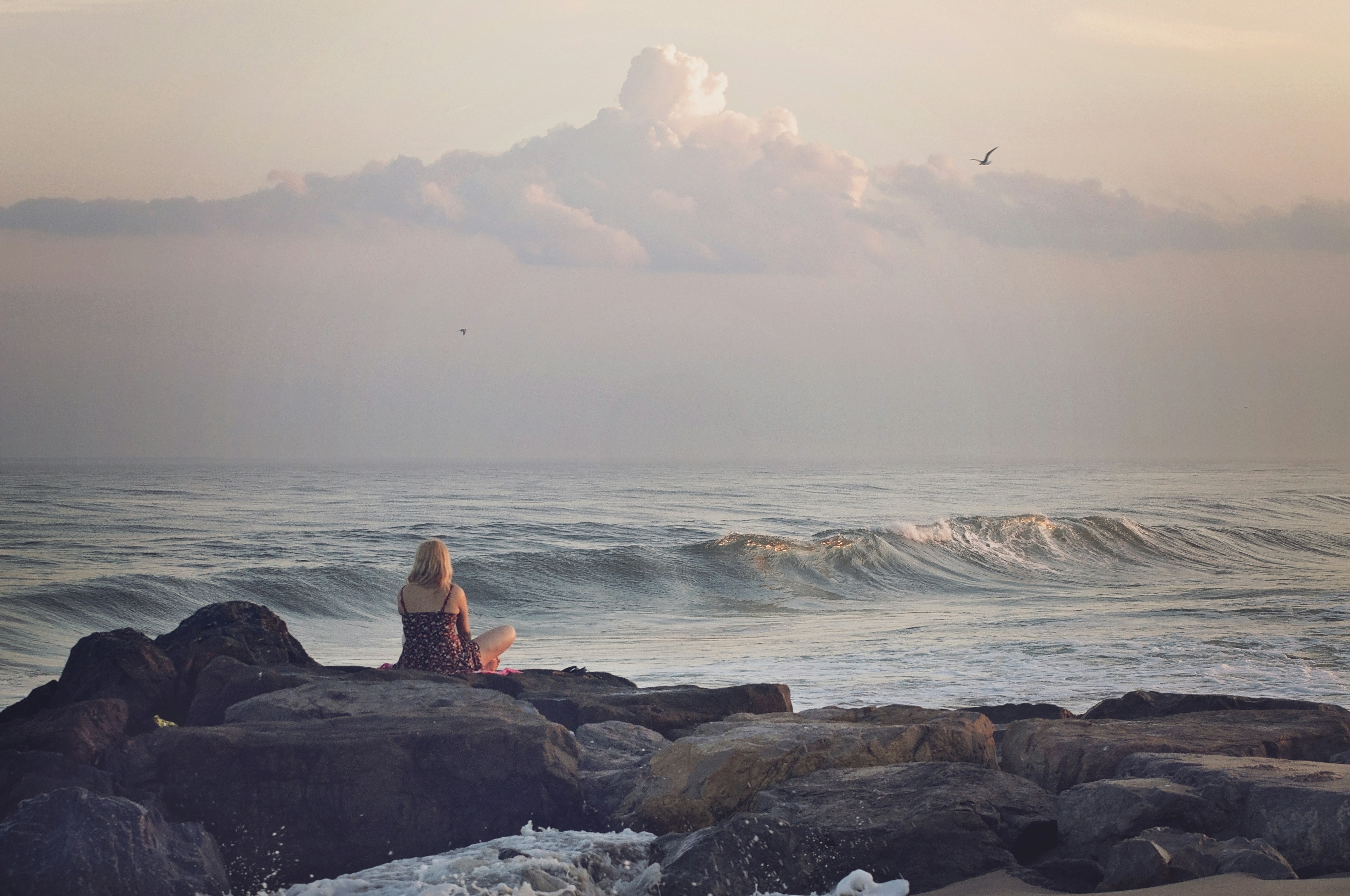 Woman Watching Ocean by the Seaside
